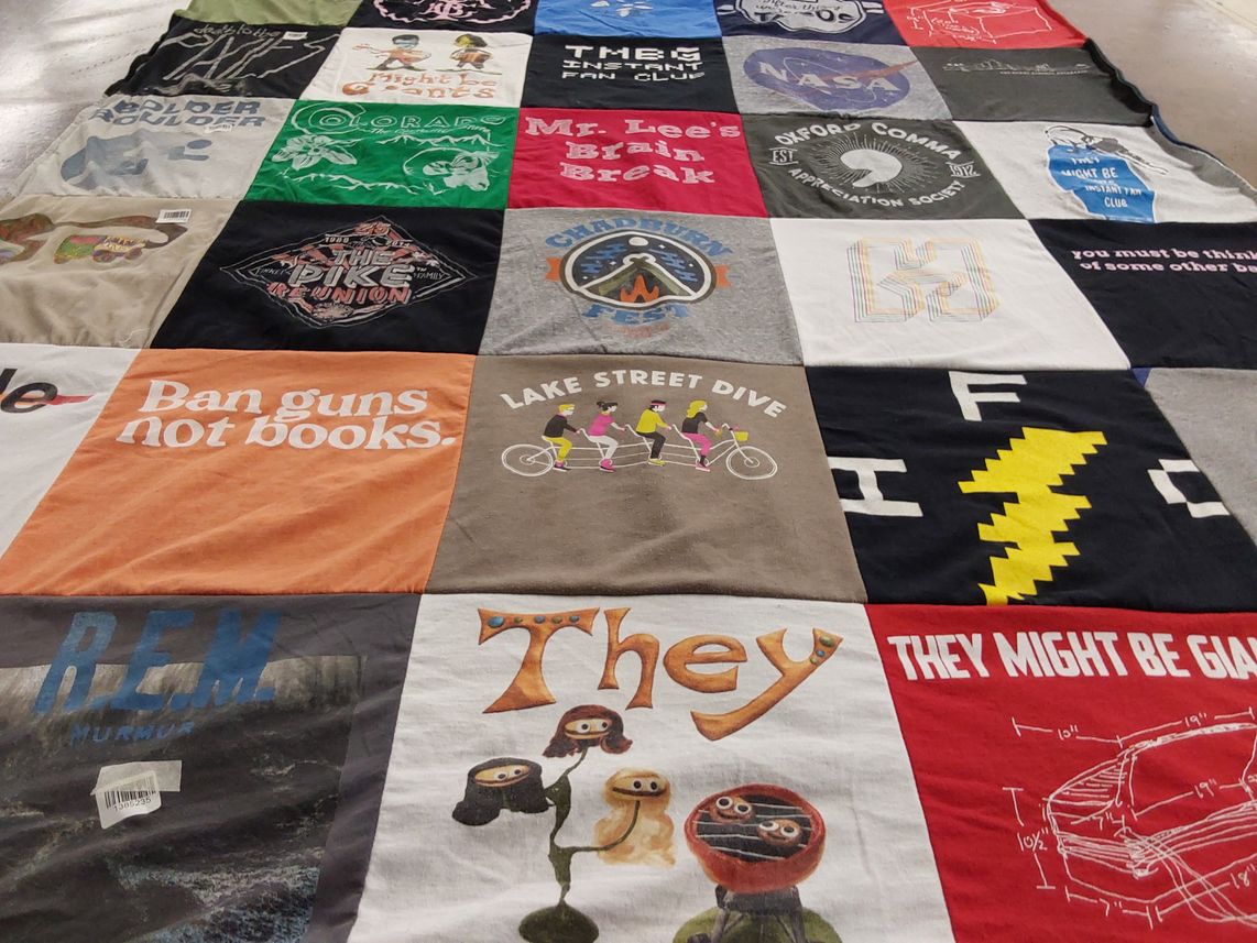 T-shirt quilt with music, reading themes by Chad from CO