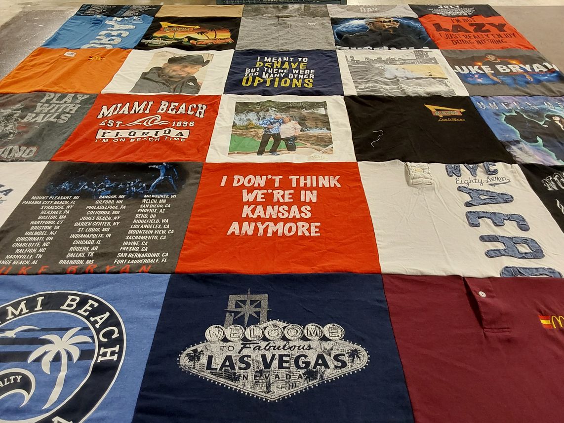 T-shirt quilt with travel, music themes by CARRIE from WI