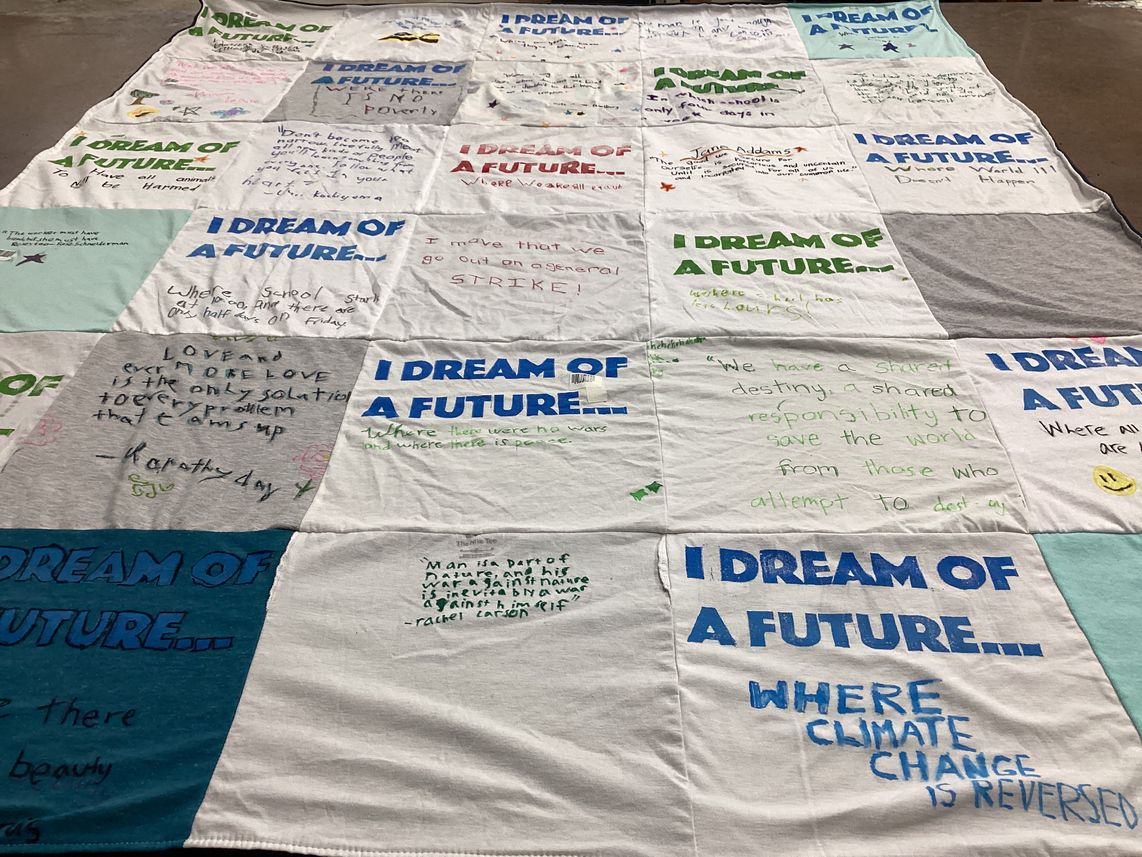 T-shirt quilt with social justice, climate action themes by Mario from UT