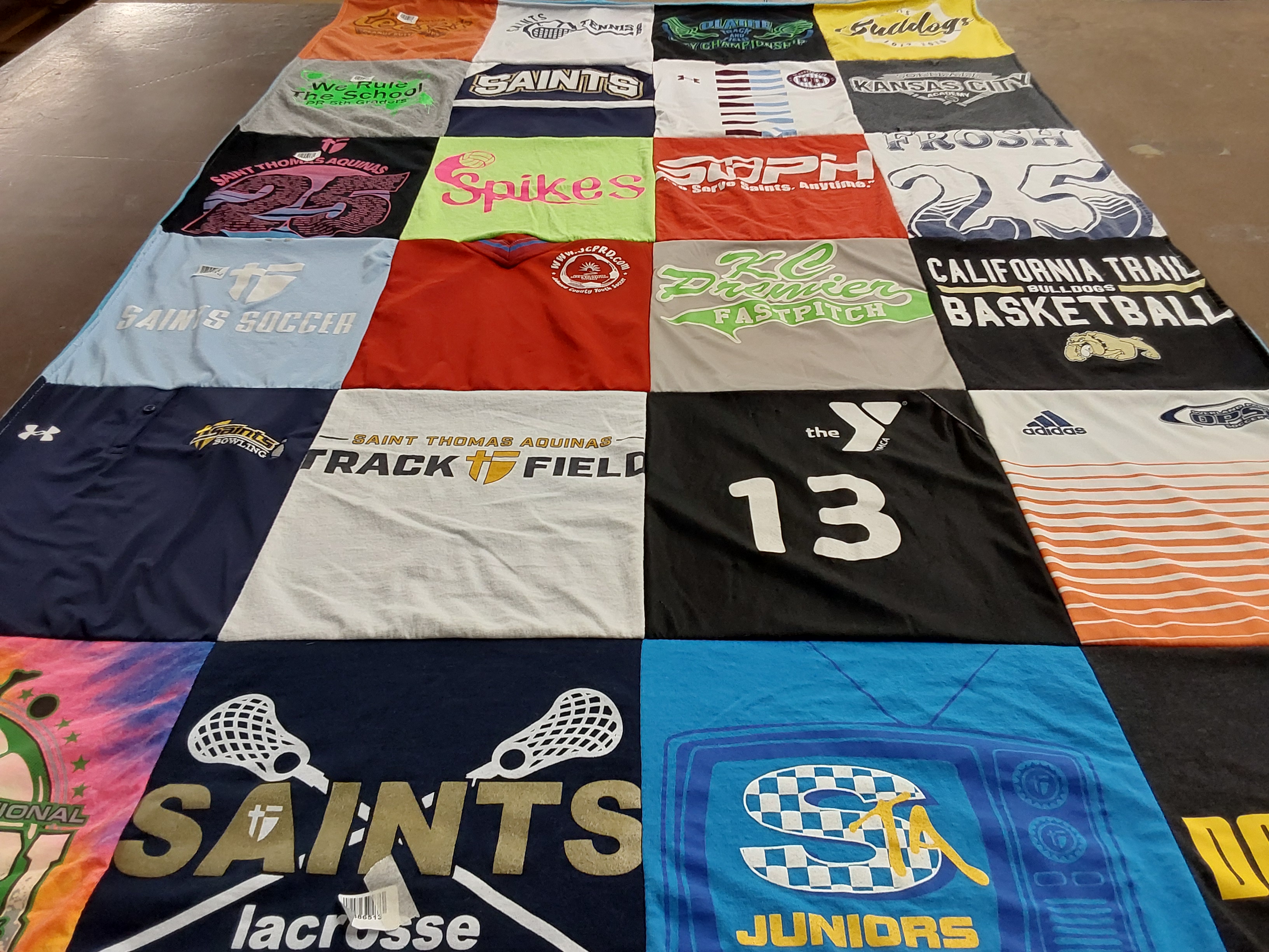 T-shirt quilt featuring saint thomas aquinas track field, california trail bulldogs by H from KS