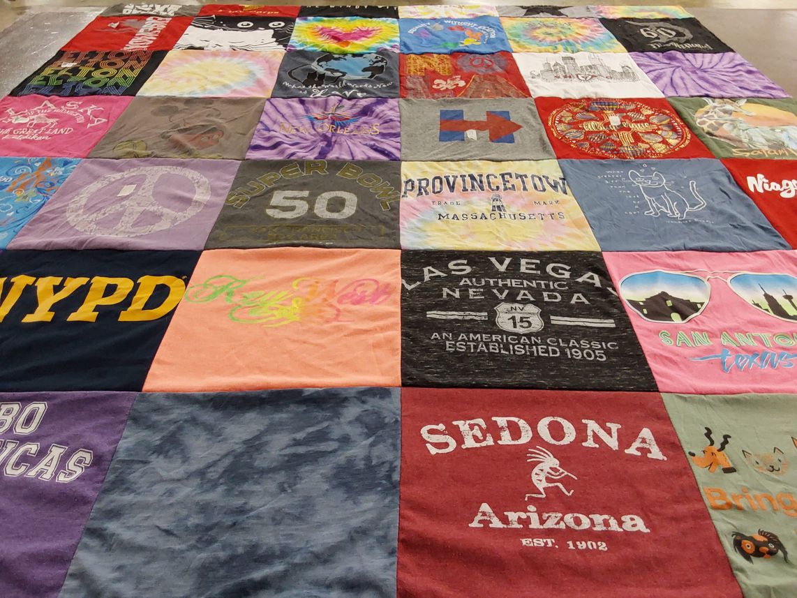 T-shirt quilt with sports, travel themes by Dee from CA