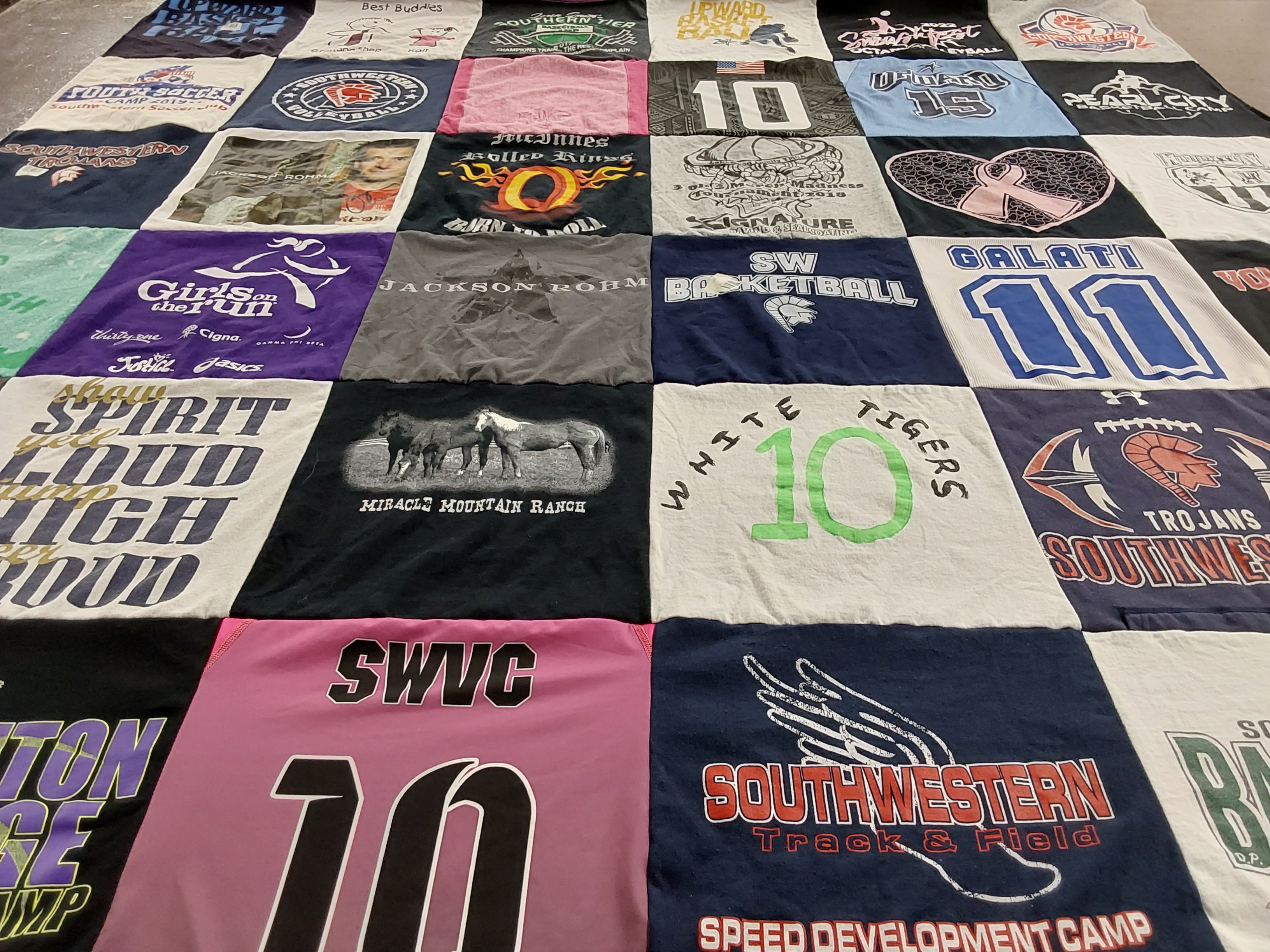 T-shirt quilt featuring white tigers, trojans by Galati from NY