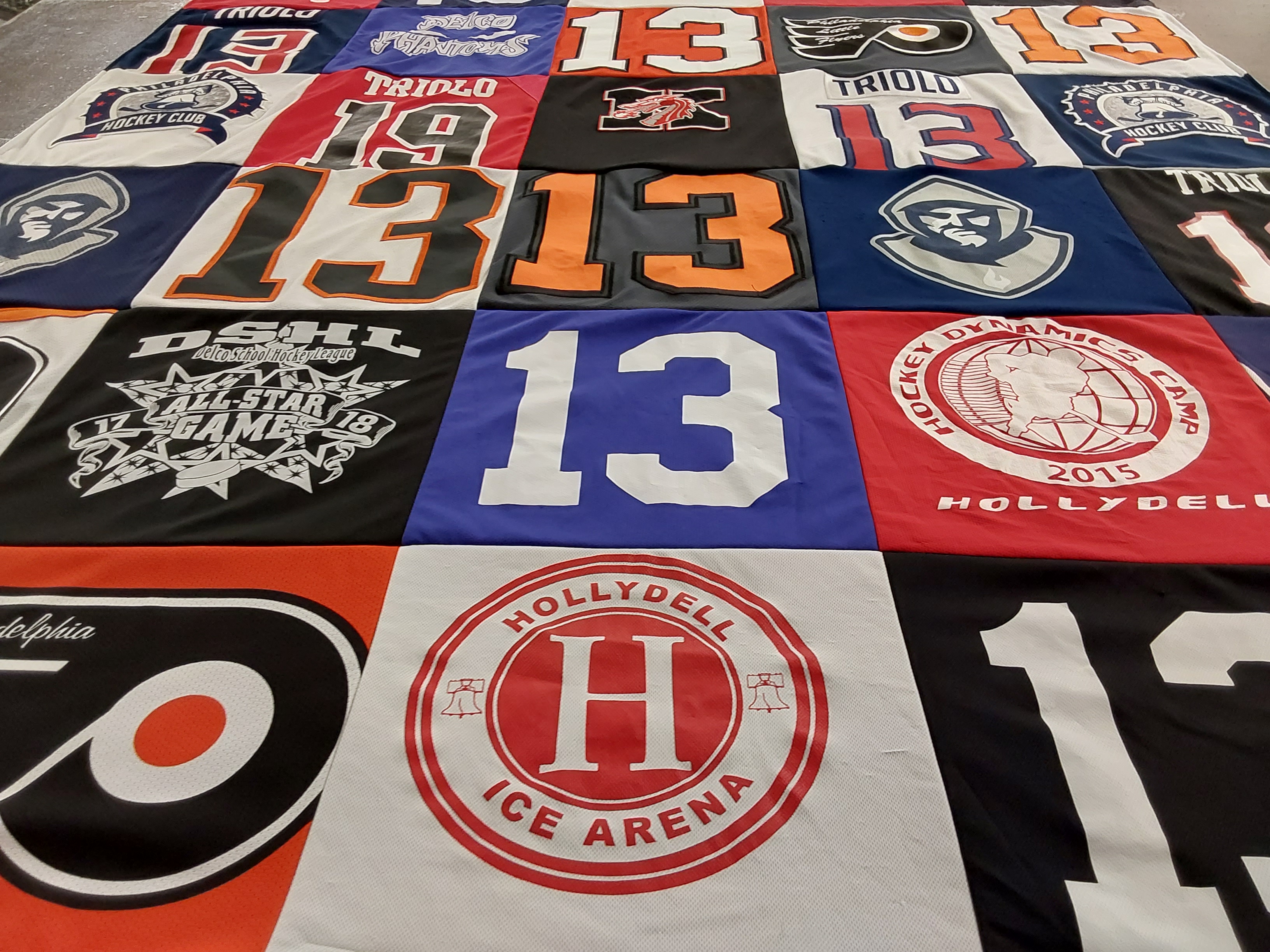 T-shirt quilt with hockey, sports themes by Christina from NJ
