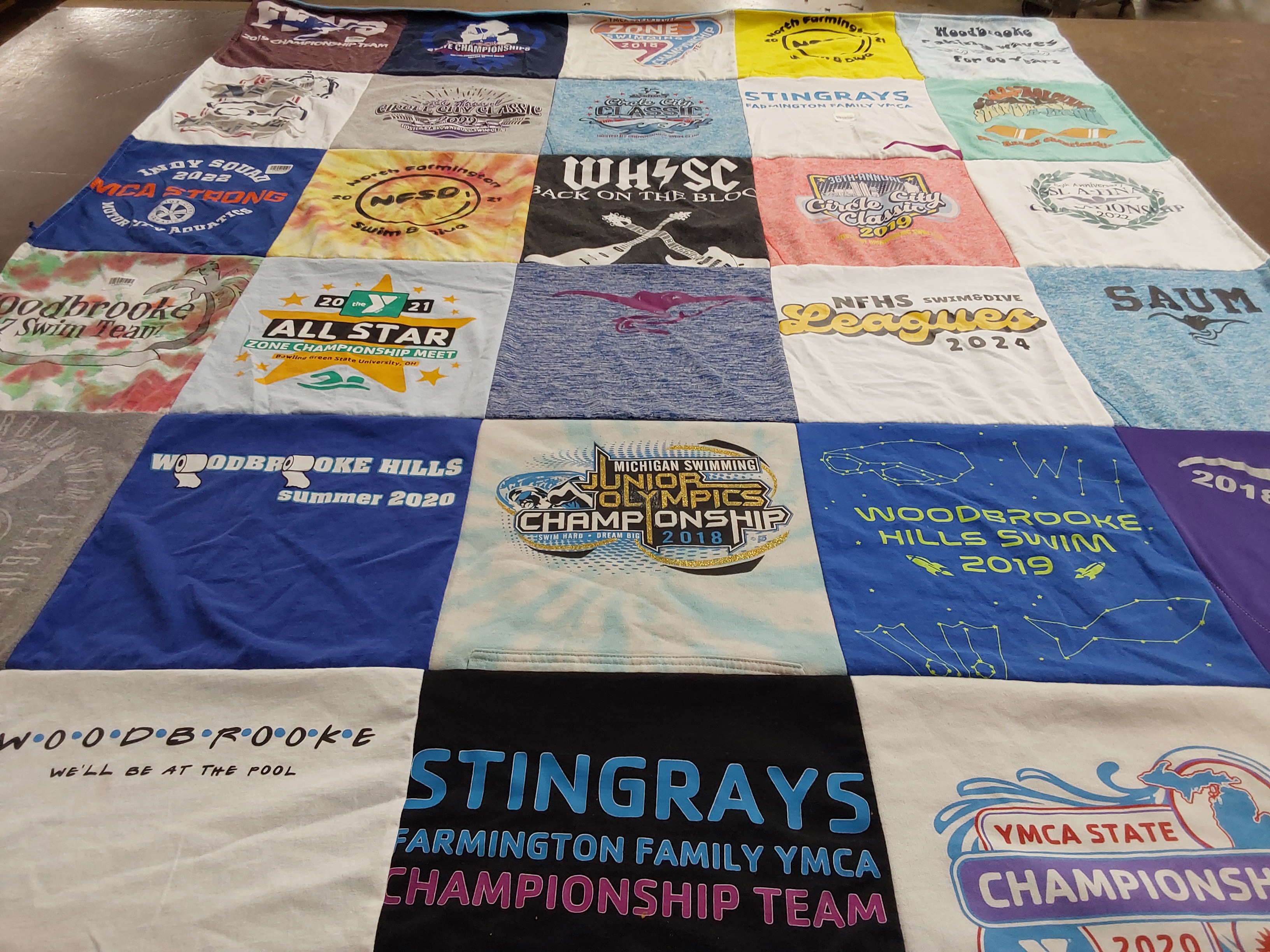 T-shirt quilt featuring stingrays swim team by Adam from MI