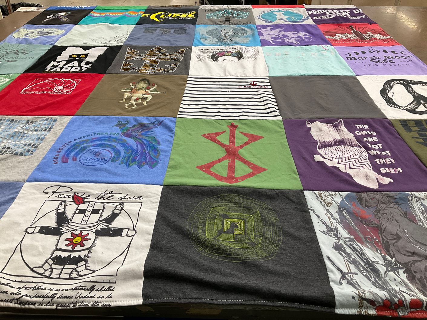 T-shirt quilt with art, music themes by Arrington from NC