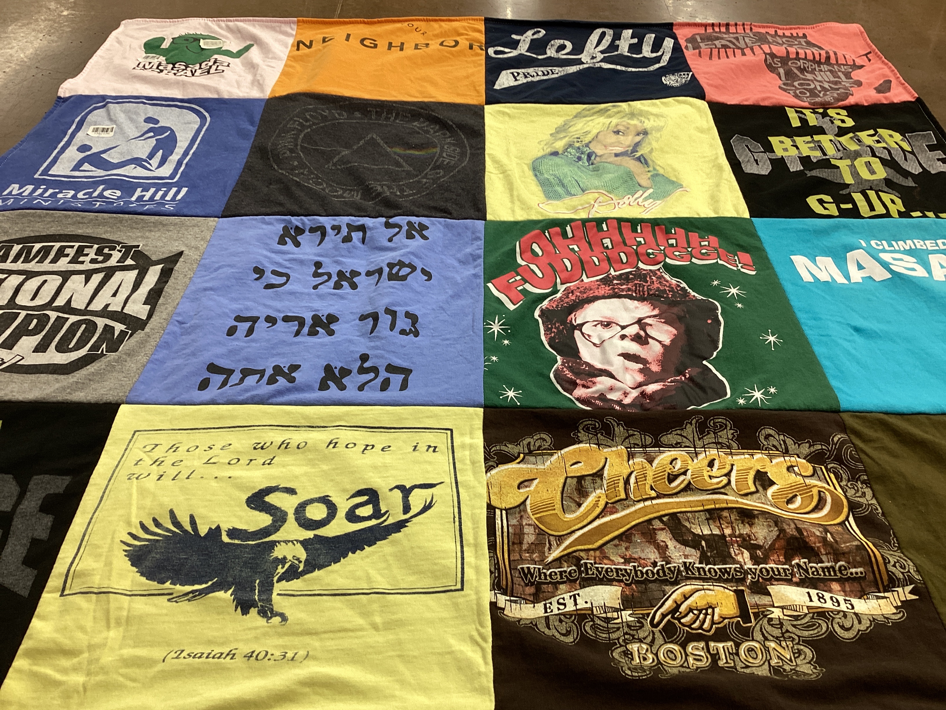 T-shirt quilt with community, sports themes by Regina from VA