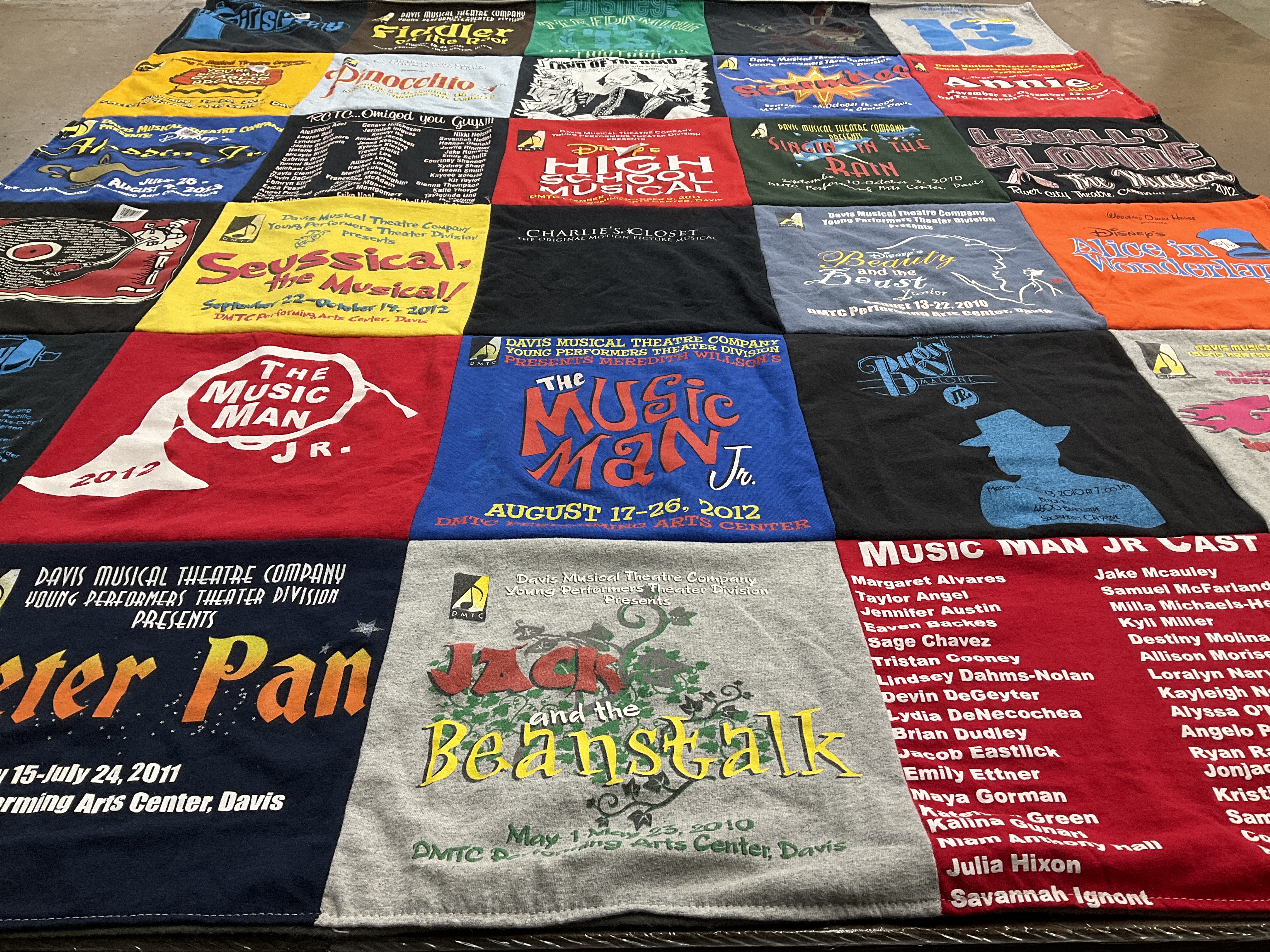 T-shirt quilt with theatre, music themes by Julienne from WA