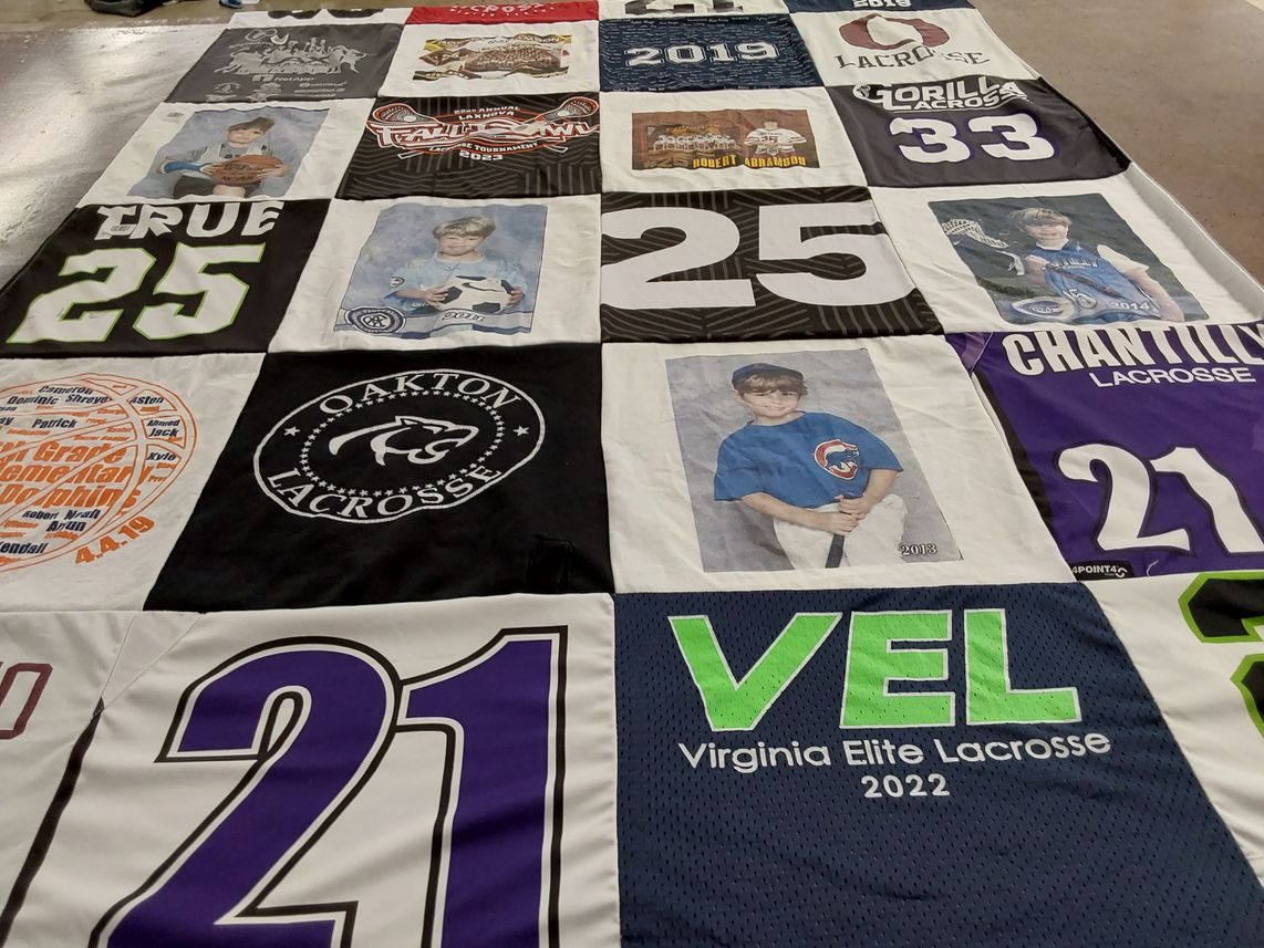 T-shirt quilt with lacrosse, sports themes by Nancy from VA