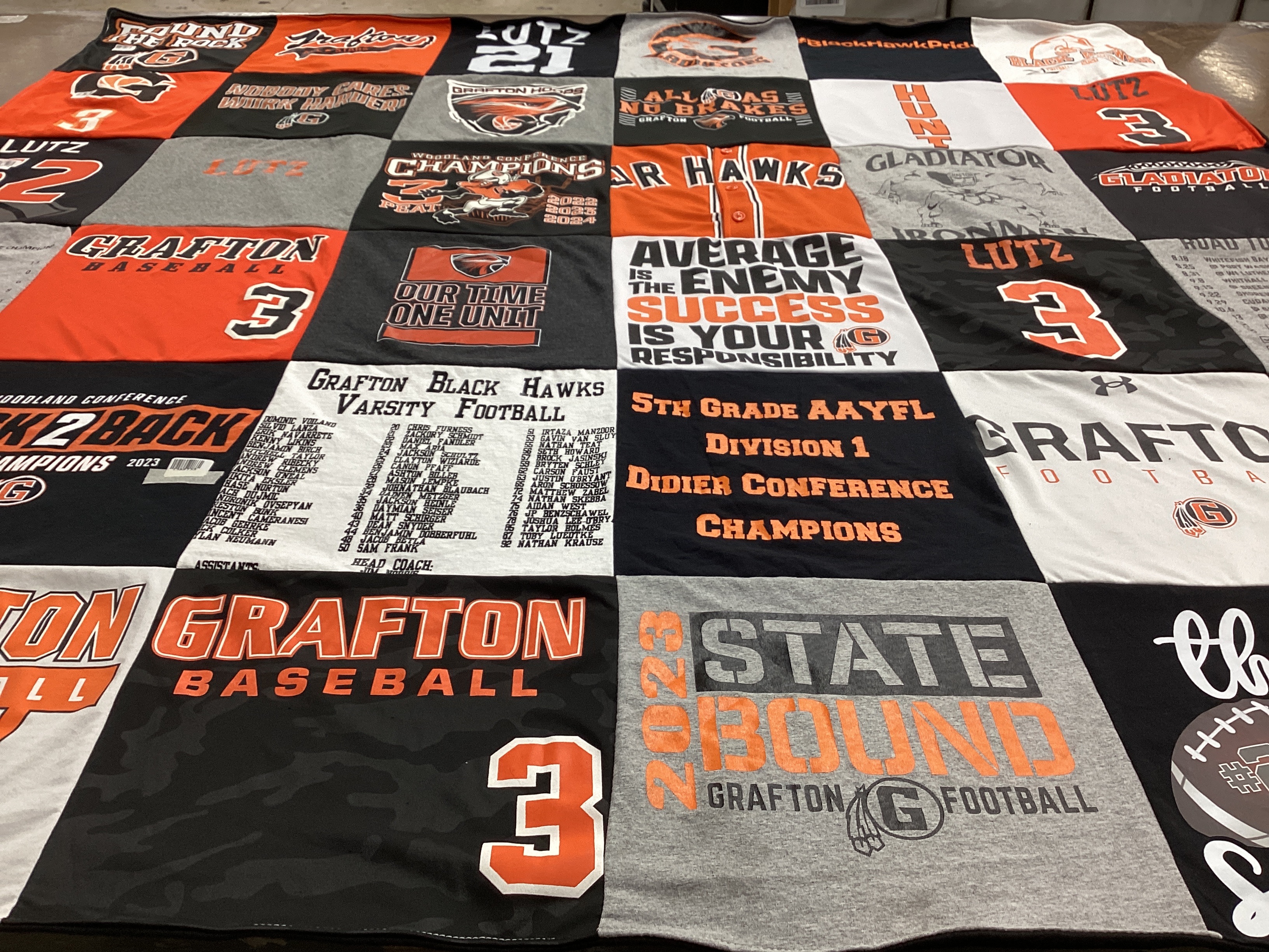 T-shirt quilt featuring grafton football, grafton black hawks by Courtney from WI