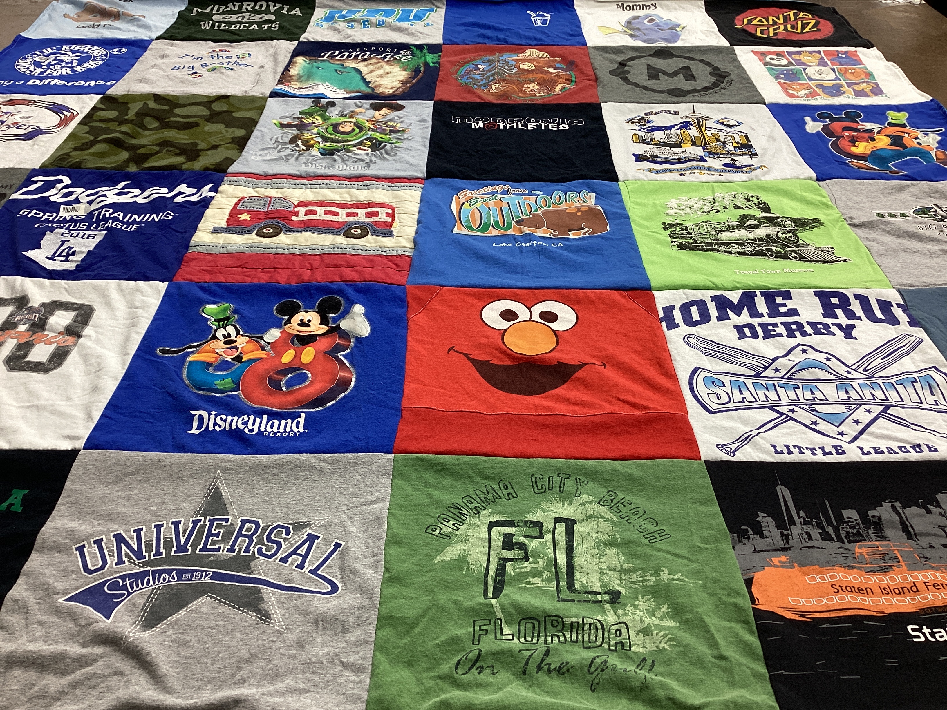 T-shirt quilt with disney, baseball themes by Stacy from CA