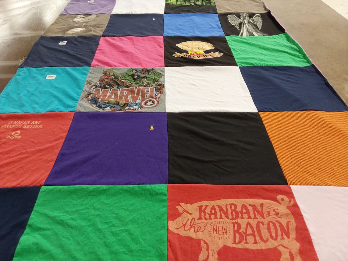 T-shirt quilt with comics, process improvement themes by Shannon from TN