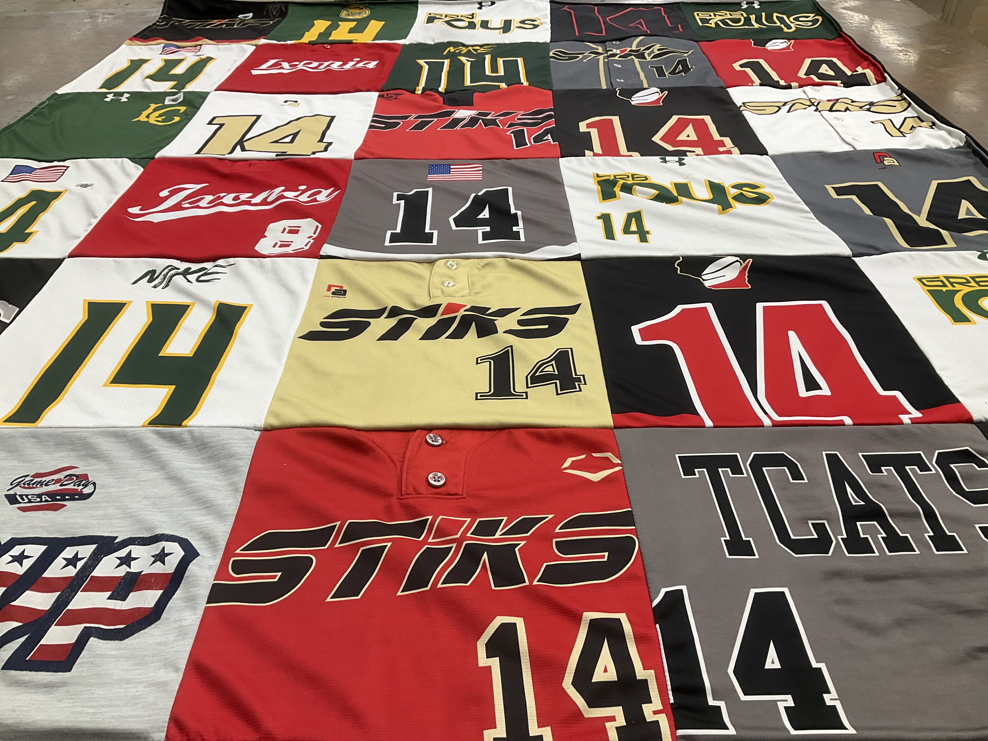 T-shirt quilt with sports, gaming themes by Devan from WI
