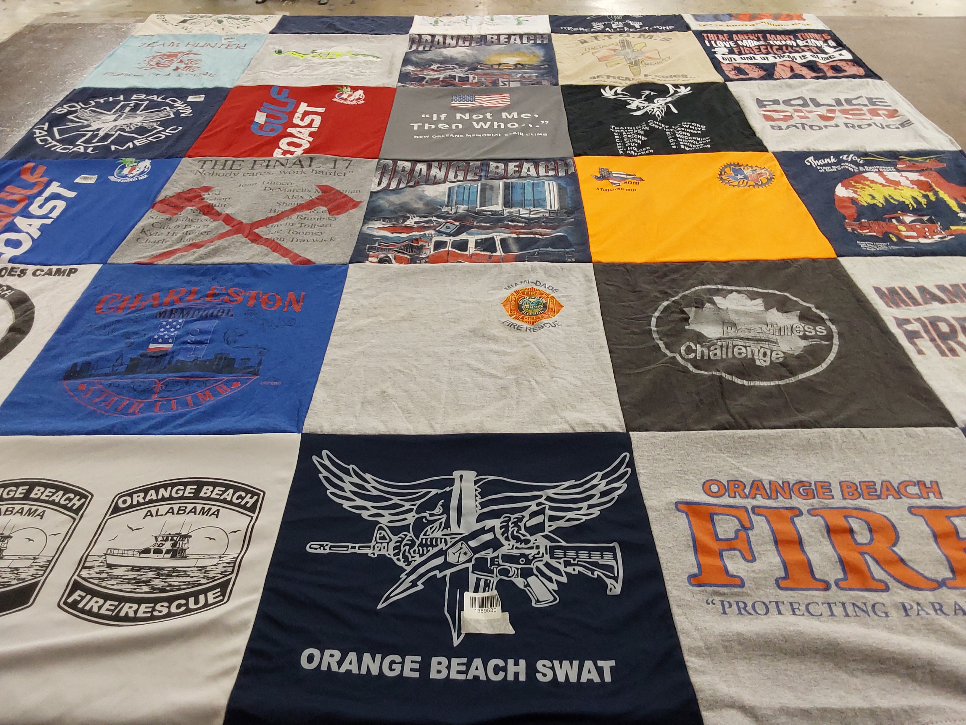 T-shirt quilt with firefighting, scouting themes by Kelly from AL