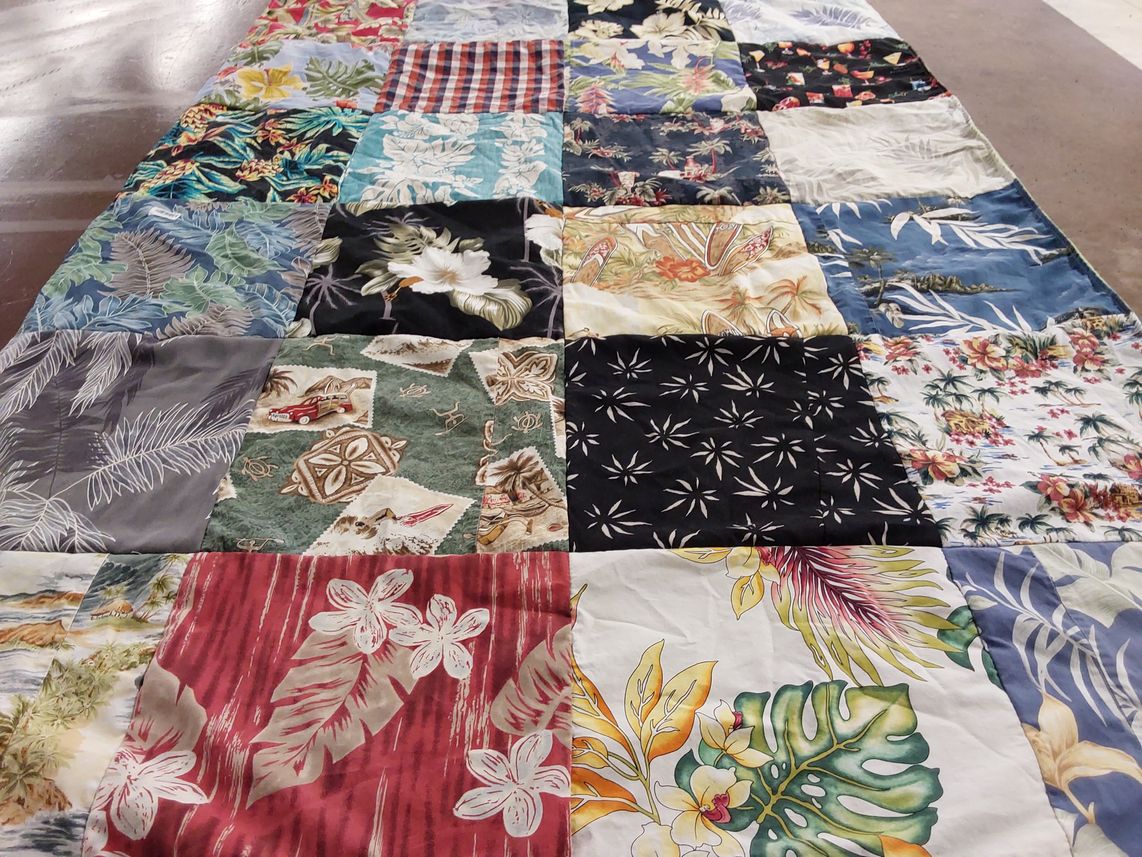 T-shirt quilt with quilting, sewing themes by Lindsay from CA