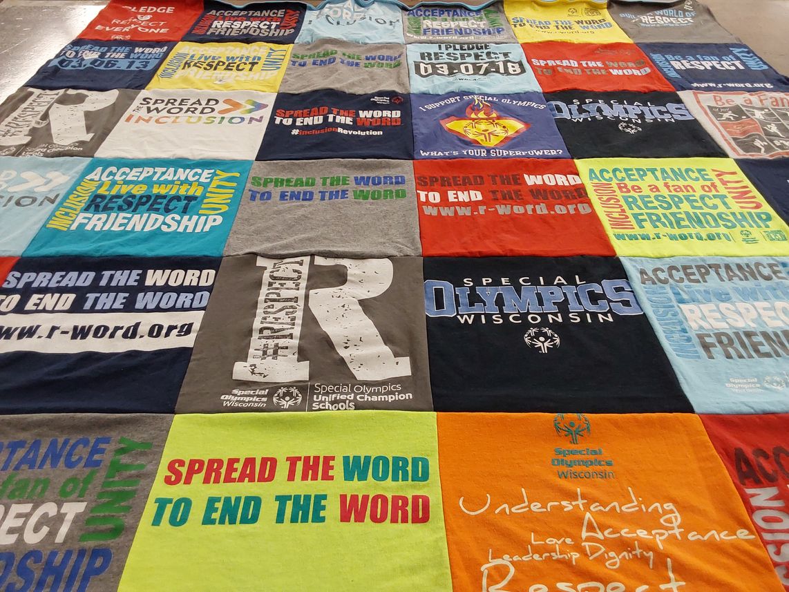 T-shirt quilt with special olympics, inclusion advocacy themes by Gloria from WI
