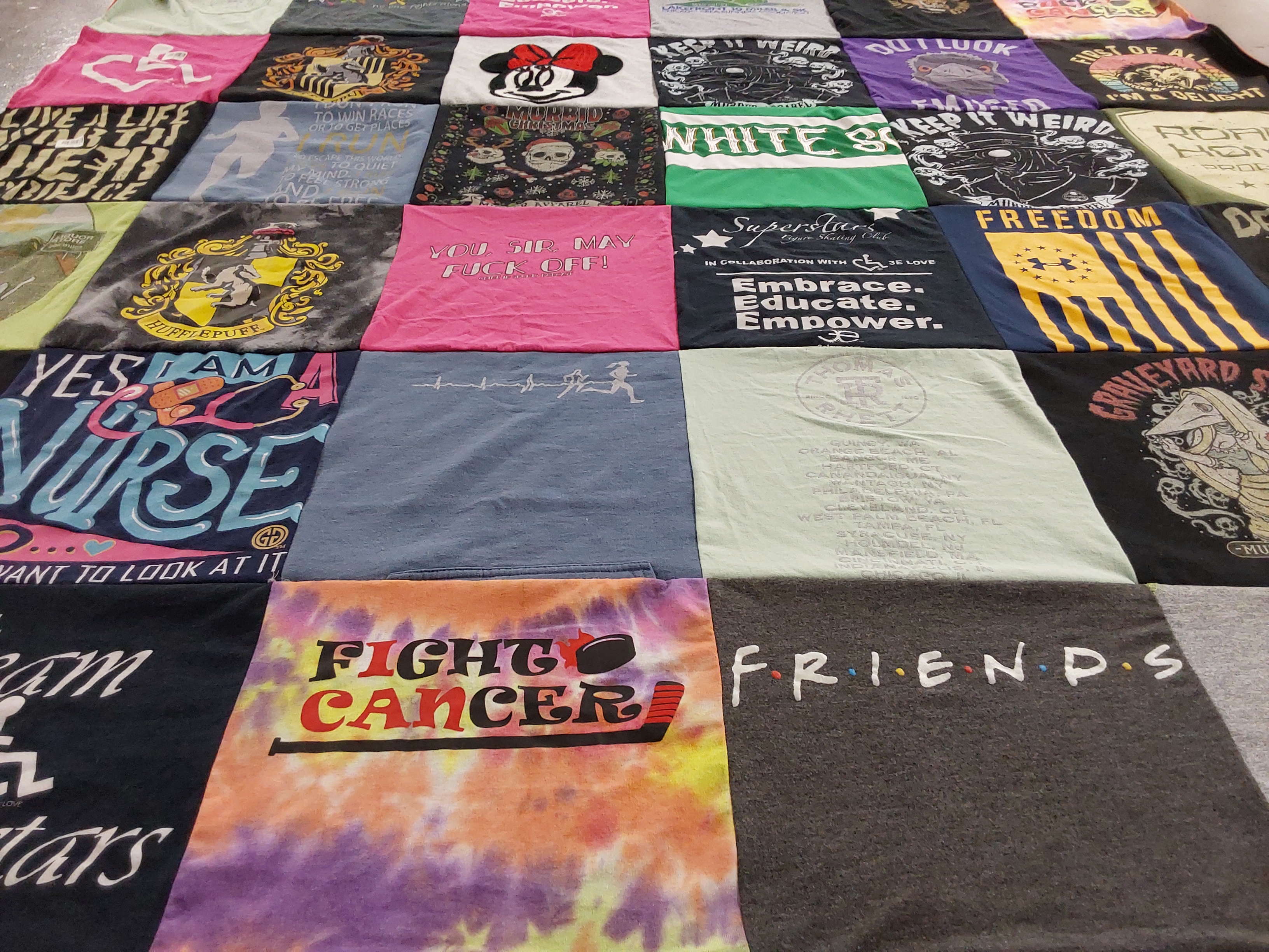 T-shirt quilt with nursing, supporting cancer research themes by Keren from IL
