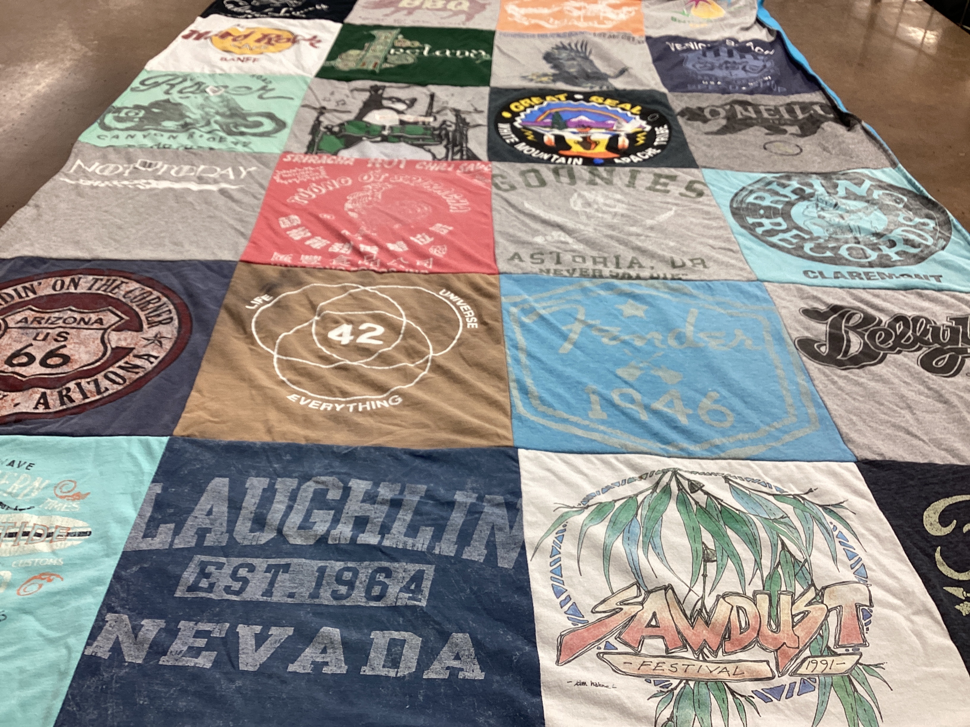 T-shirt quilt with travel, music themes by Mary from CA