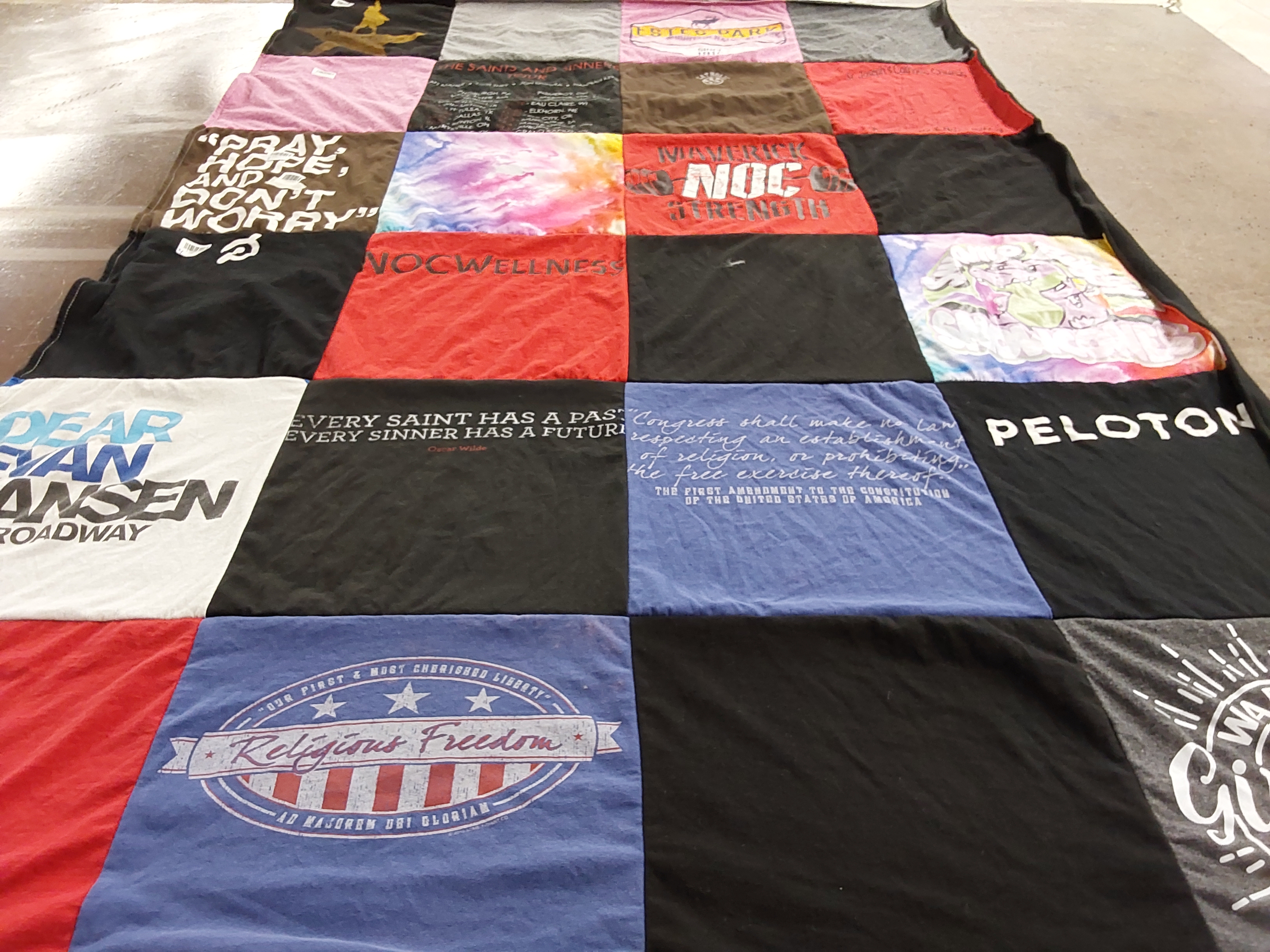 T-shirt quilt with theater, wellness themes by Zailette from OK