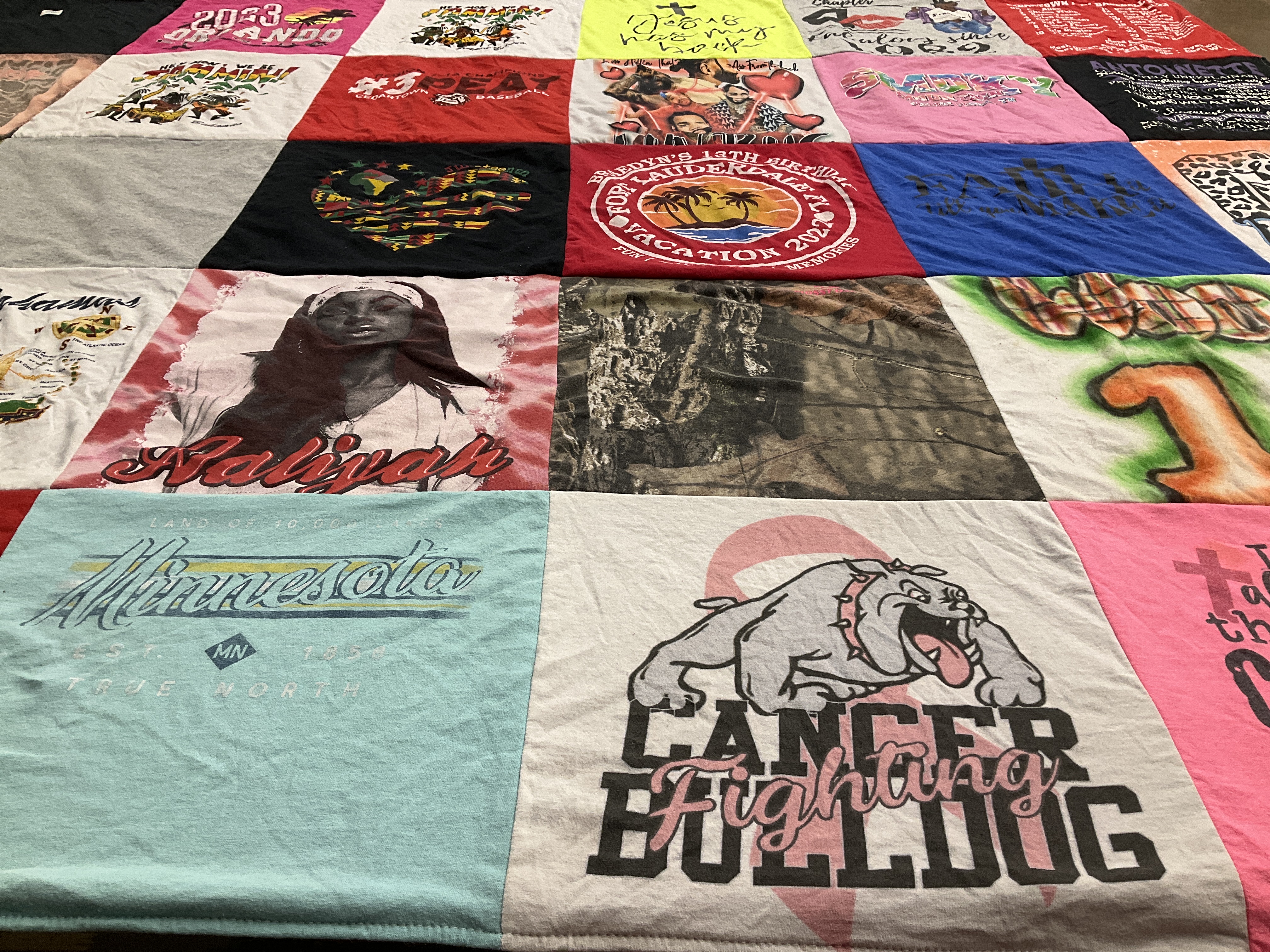 T-shirt quilt with sports, cancer awareness themes by Jahleyah from GA
