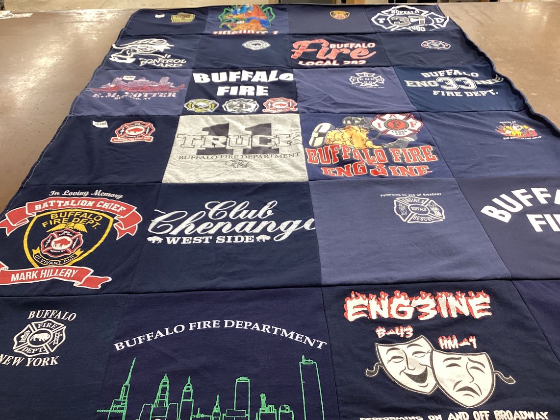 T-shirt quilt with firefighting, community service themes by Lydia from NY