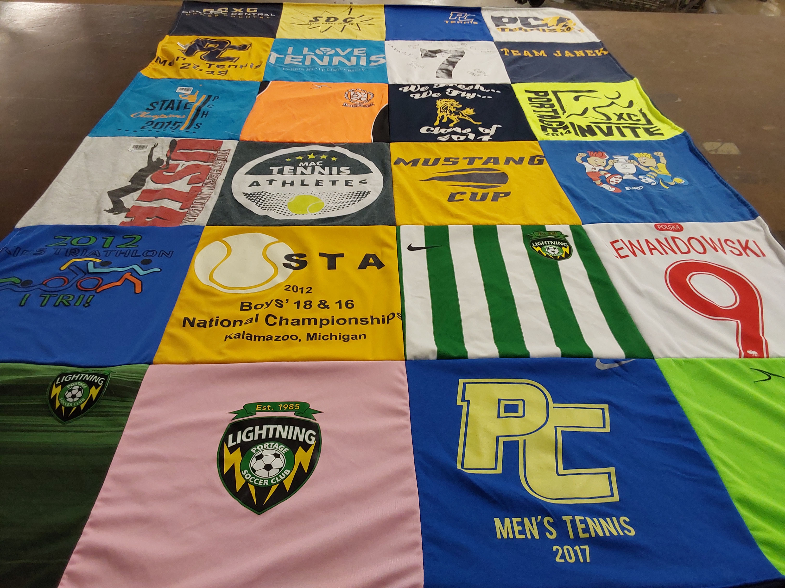 T-shirt quilt featuring portage central high school men's tennis, lightning soccer club by Jan from MI