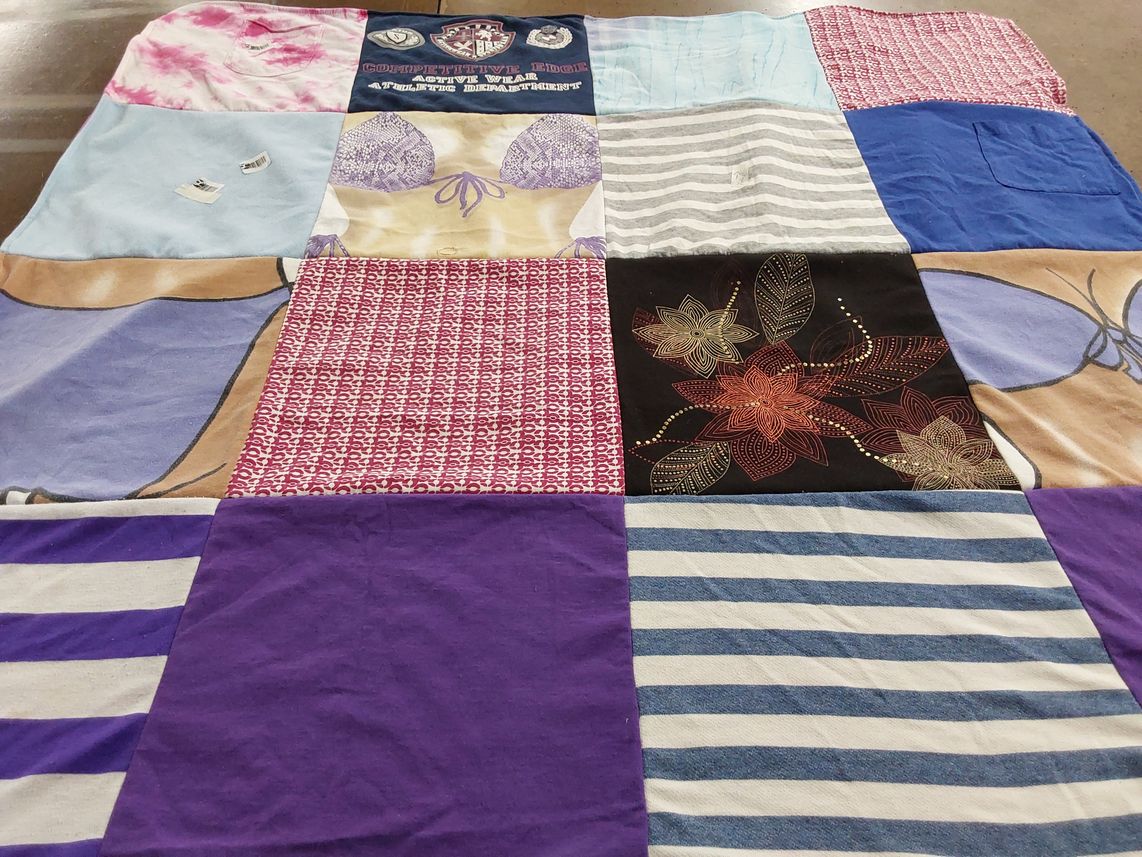 T-shirt quilt with sports, fitness themes by Desirae from OH