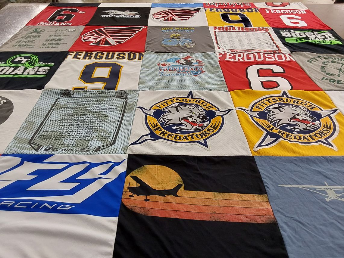 T-shirt quilt with hockey, sports themes by Christi from PA
