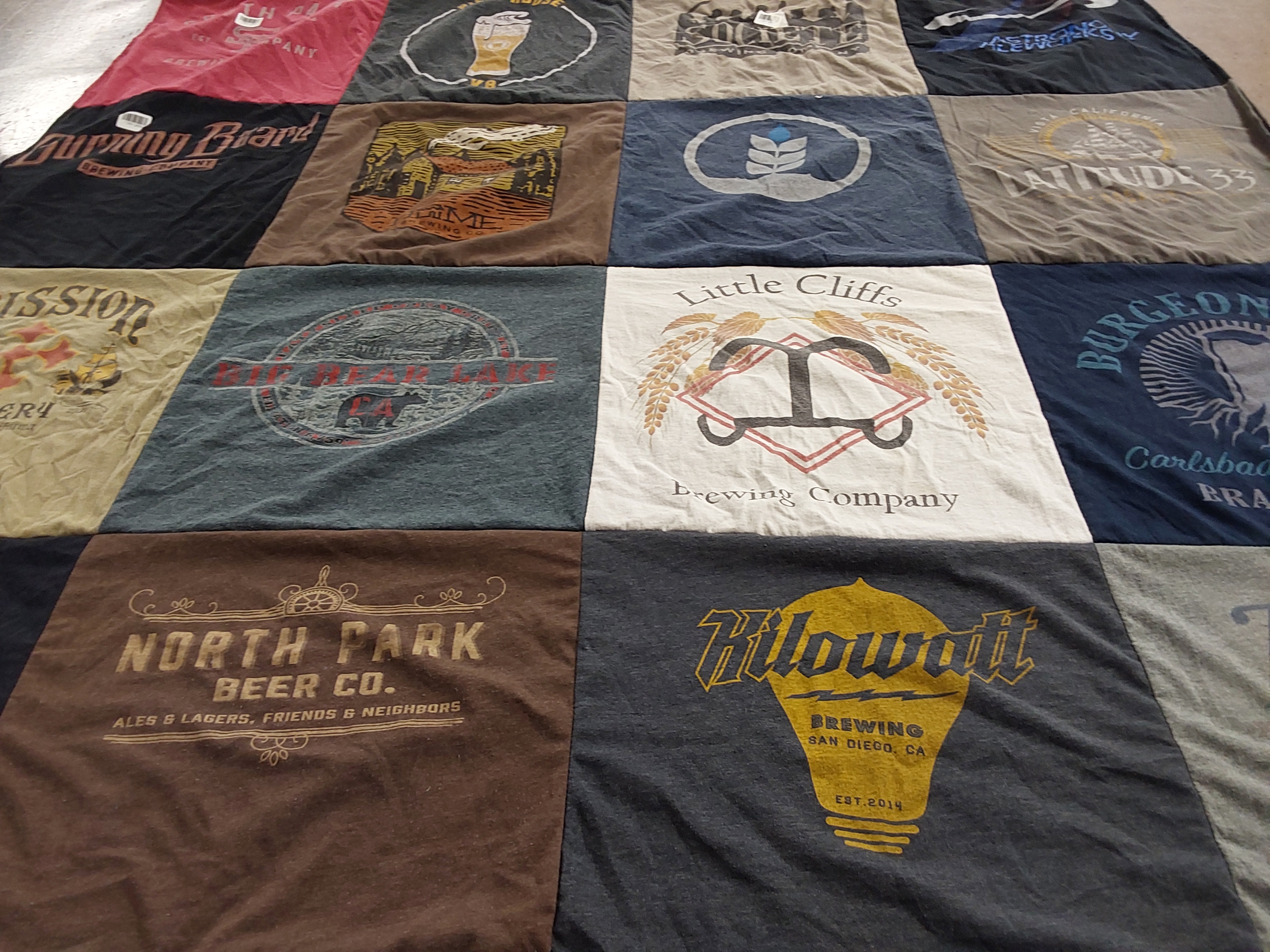 T-shirt quilt with brewing, craft beer themes by Jill from NV