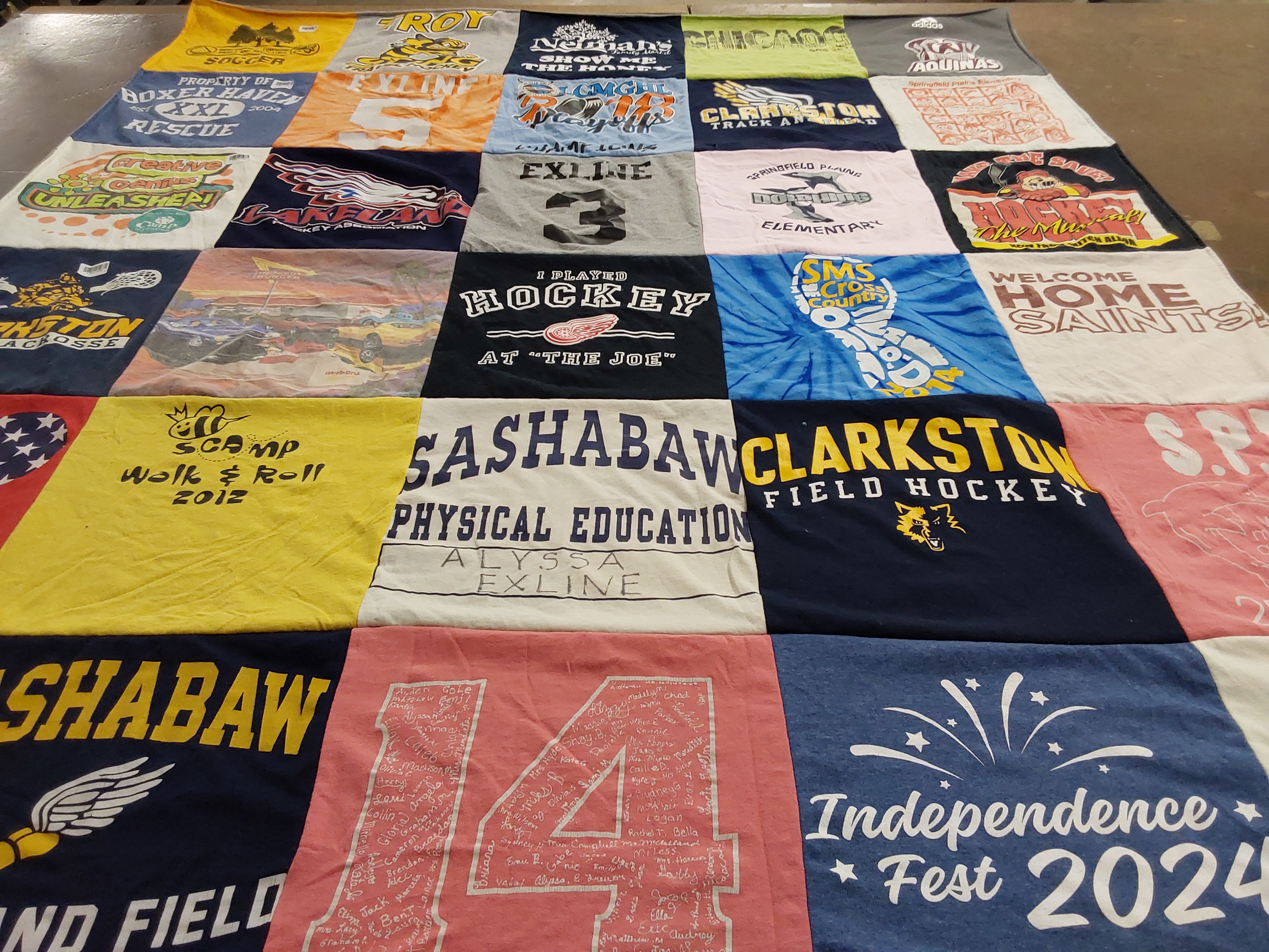 T-shirt quilt featuring clarkston field hockey team, sashabaw lacrosse team by Becky from MI