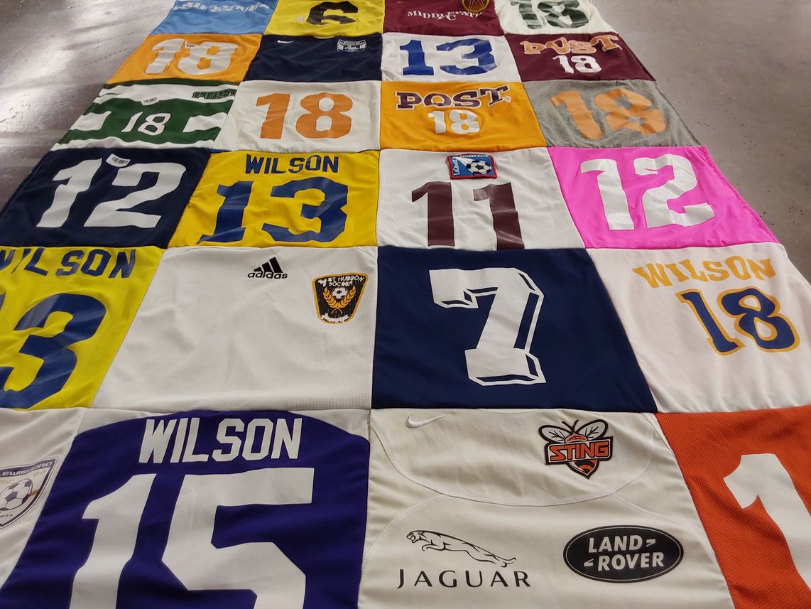 T-shirt quilt with sports, soccer themes by nancy from NY