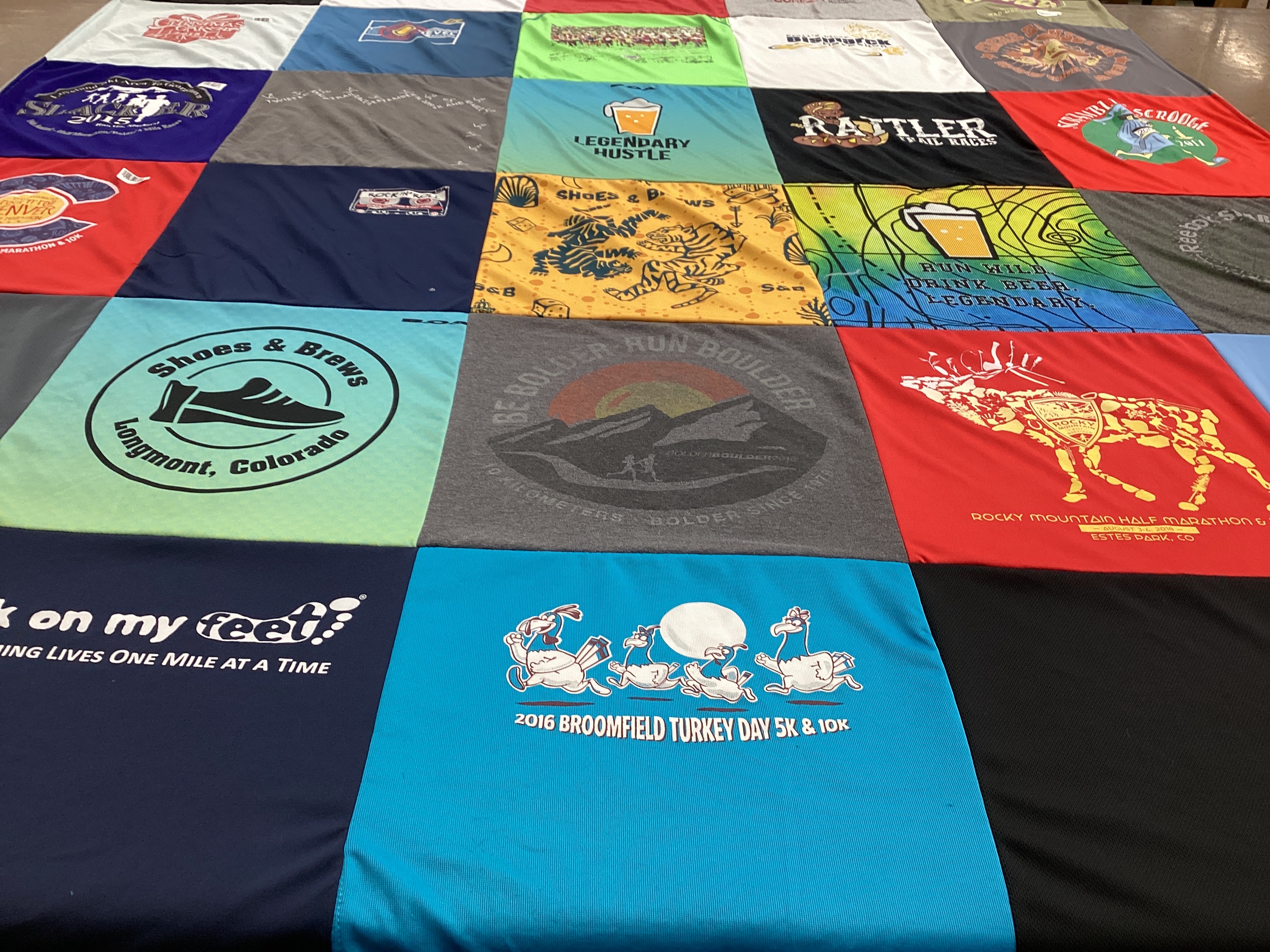 T-shirt quilt with running, brewing themes by Kayde from CO