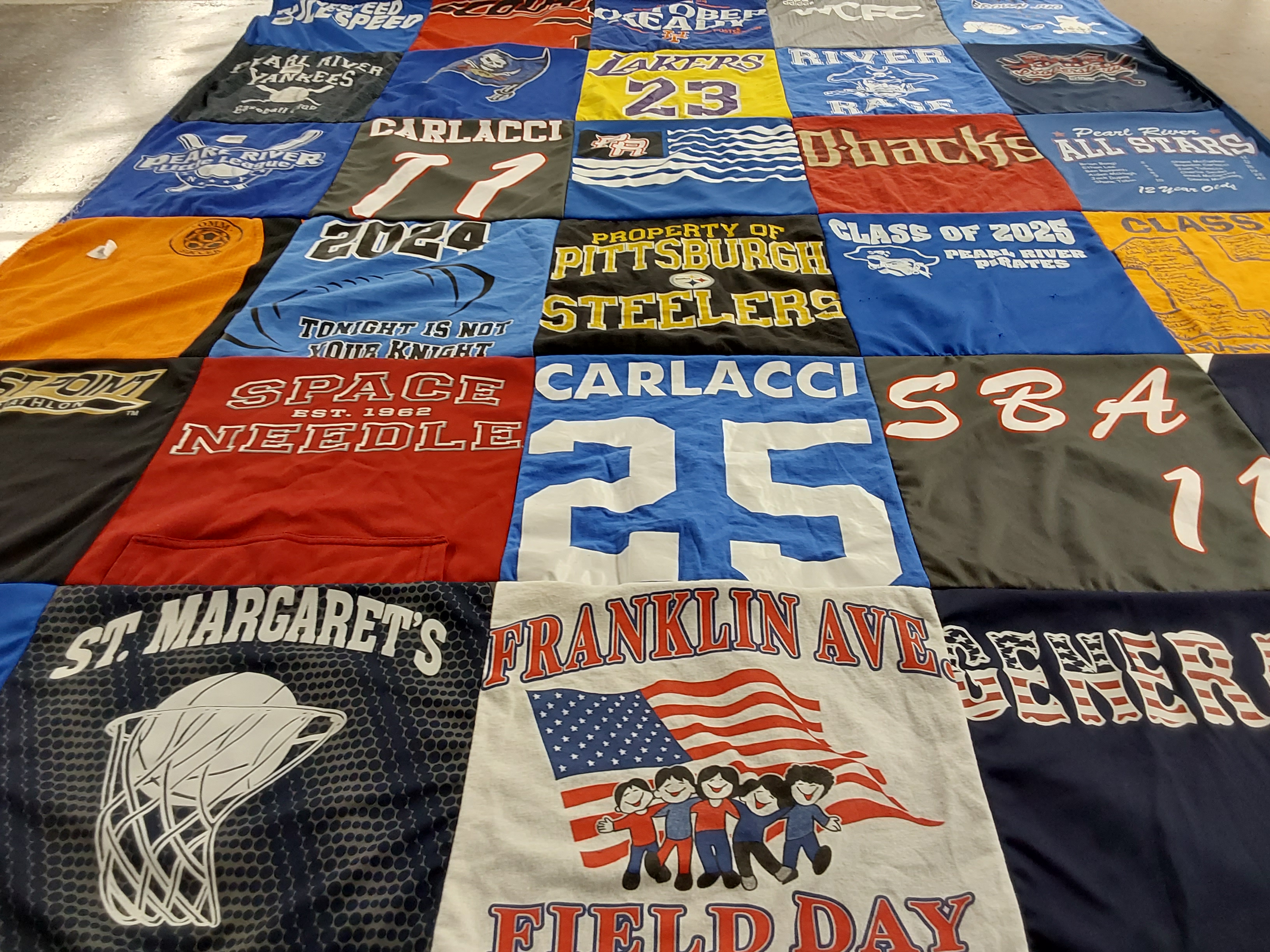 T-shirt quilt with sports, graduation themes by Shane from NY