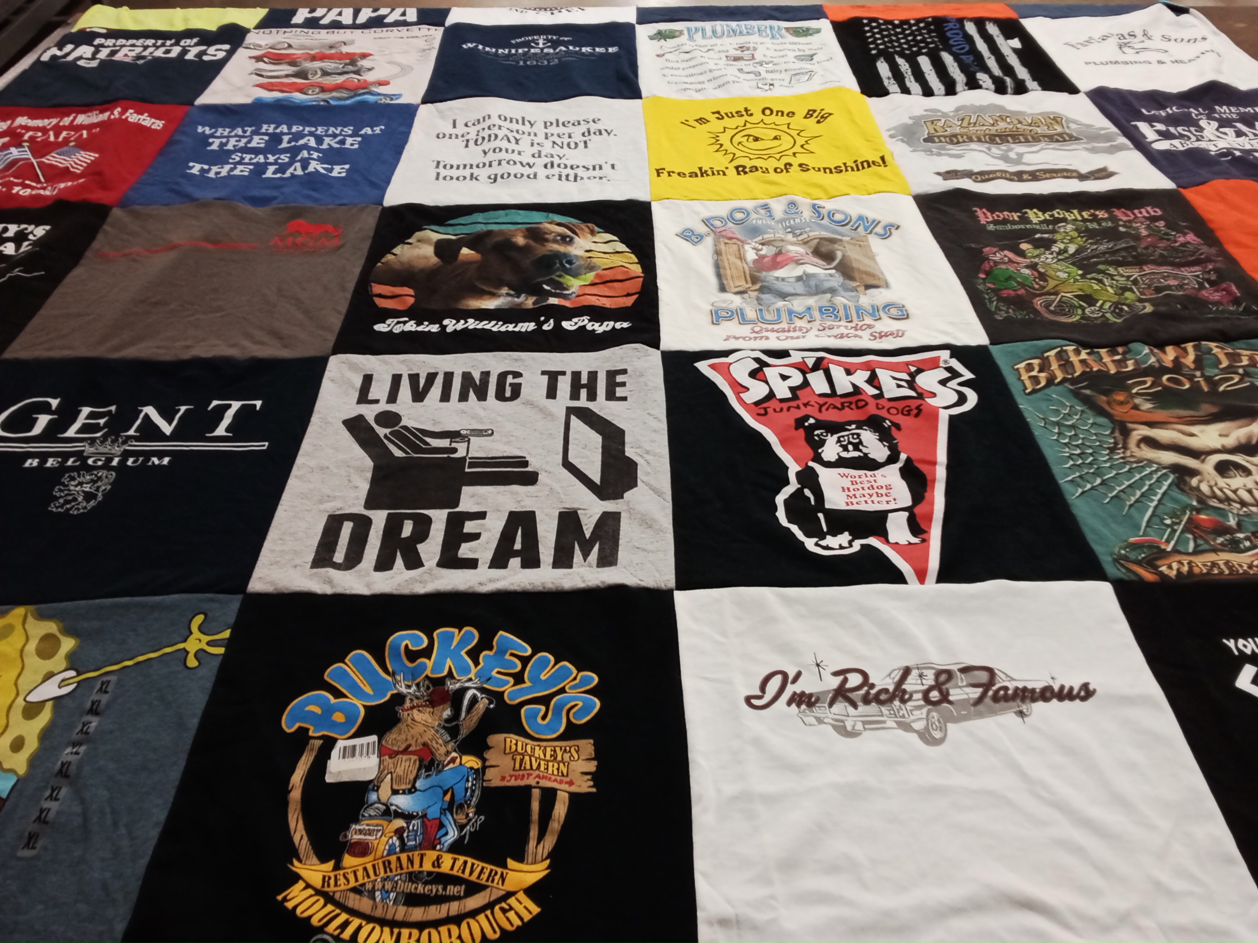 T-shirt quilt with plumbing, restaurants themes by Betty from MA