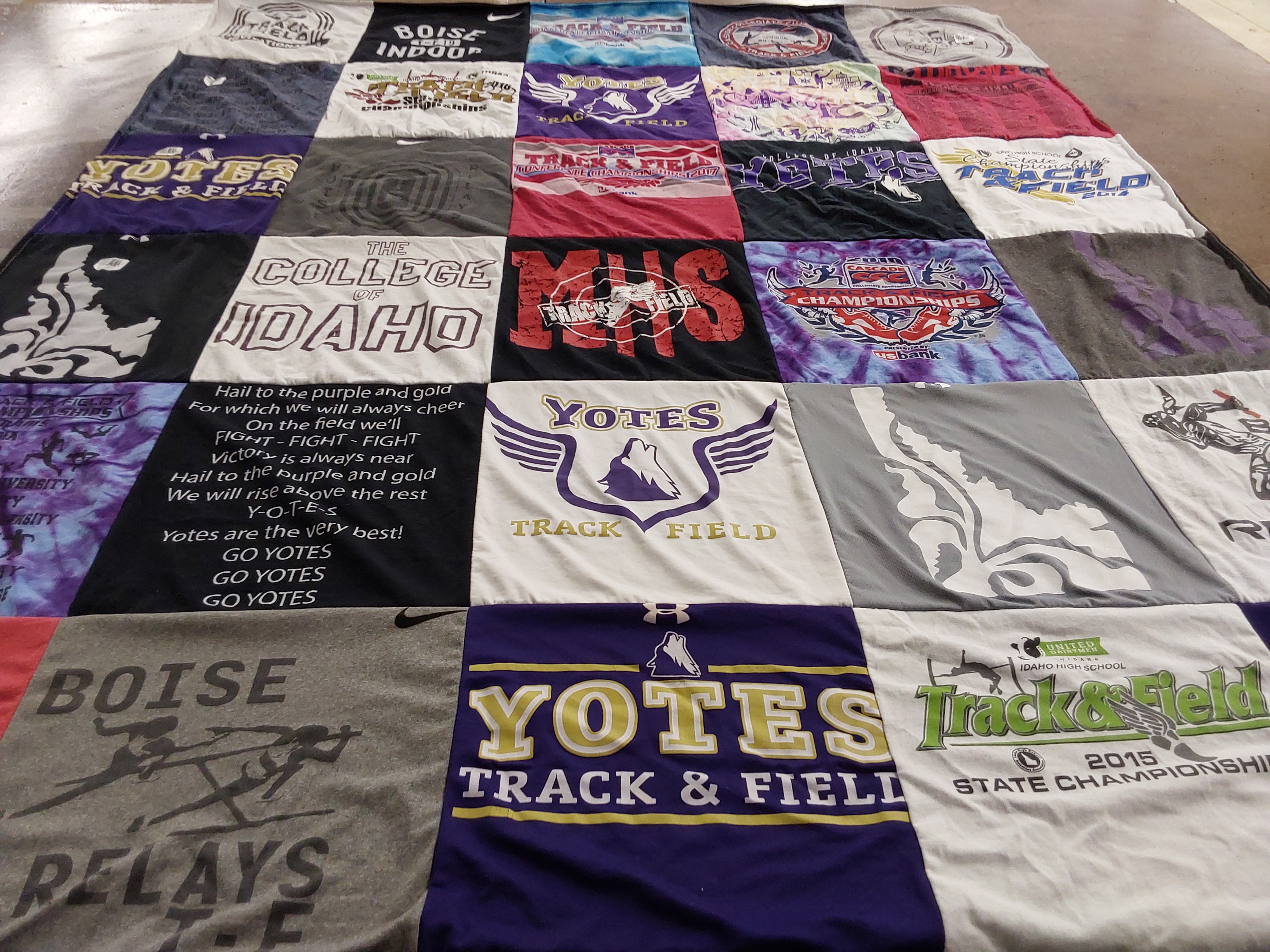 T-shirt quilt featuring yotes track and field by Kabre from ID