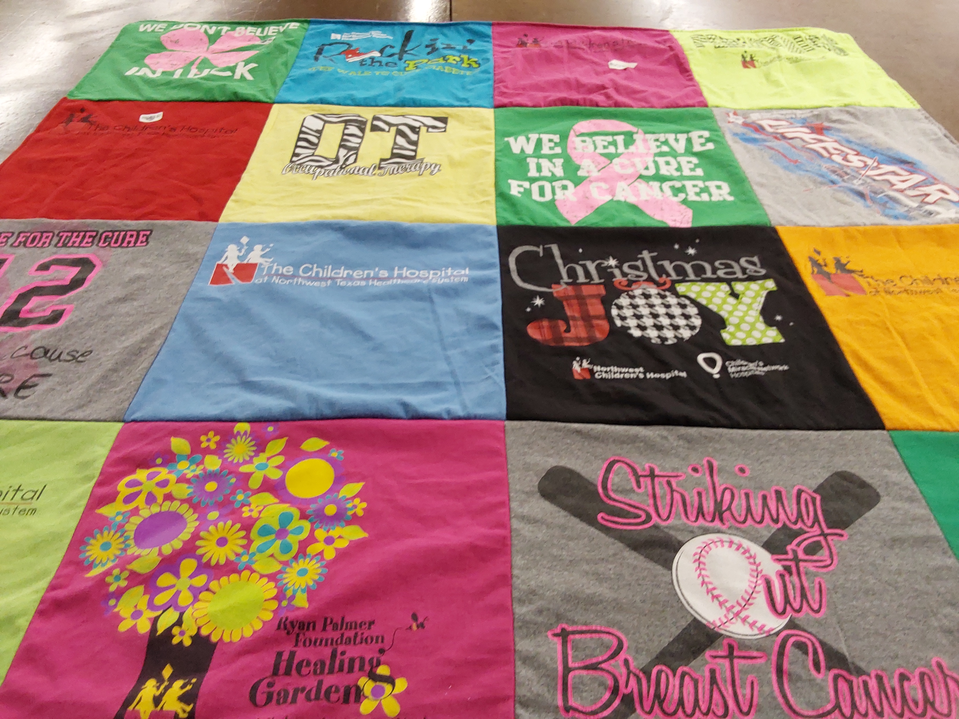 T-shirt quilt with healthcare, cancer awareness themes by Tracy from TX