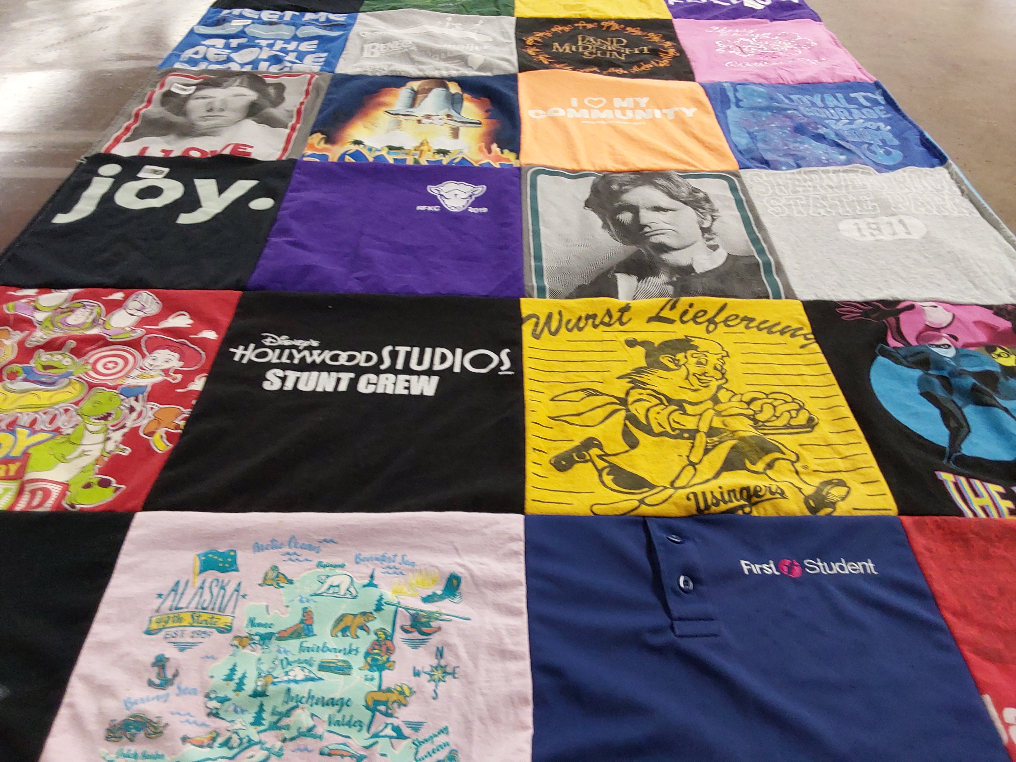 T-shirt quilt with disney, travel themes by Suzanne from WI