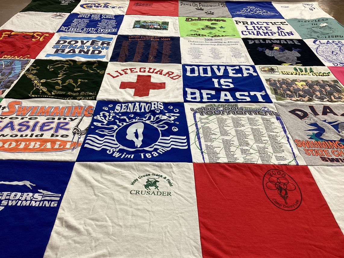 T-shirt quilt featuring dover senators swim team, holy cross track and field by Lisa from DE