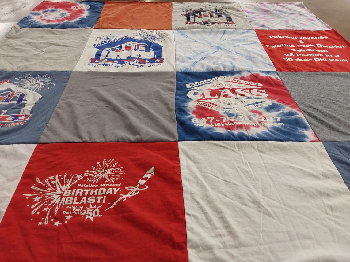 T-shirt quilt with community events, celebrations themes by Jennifer from TX