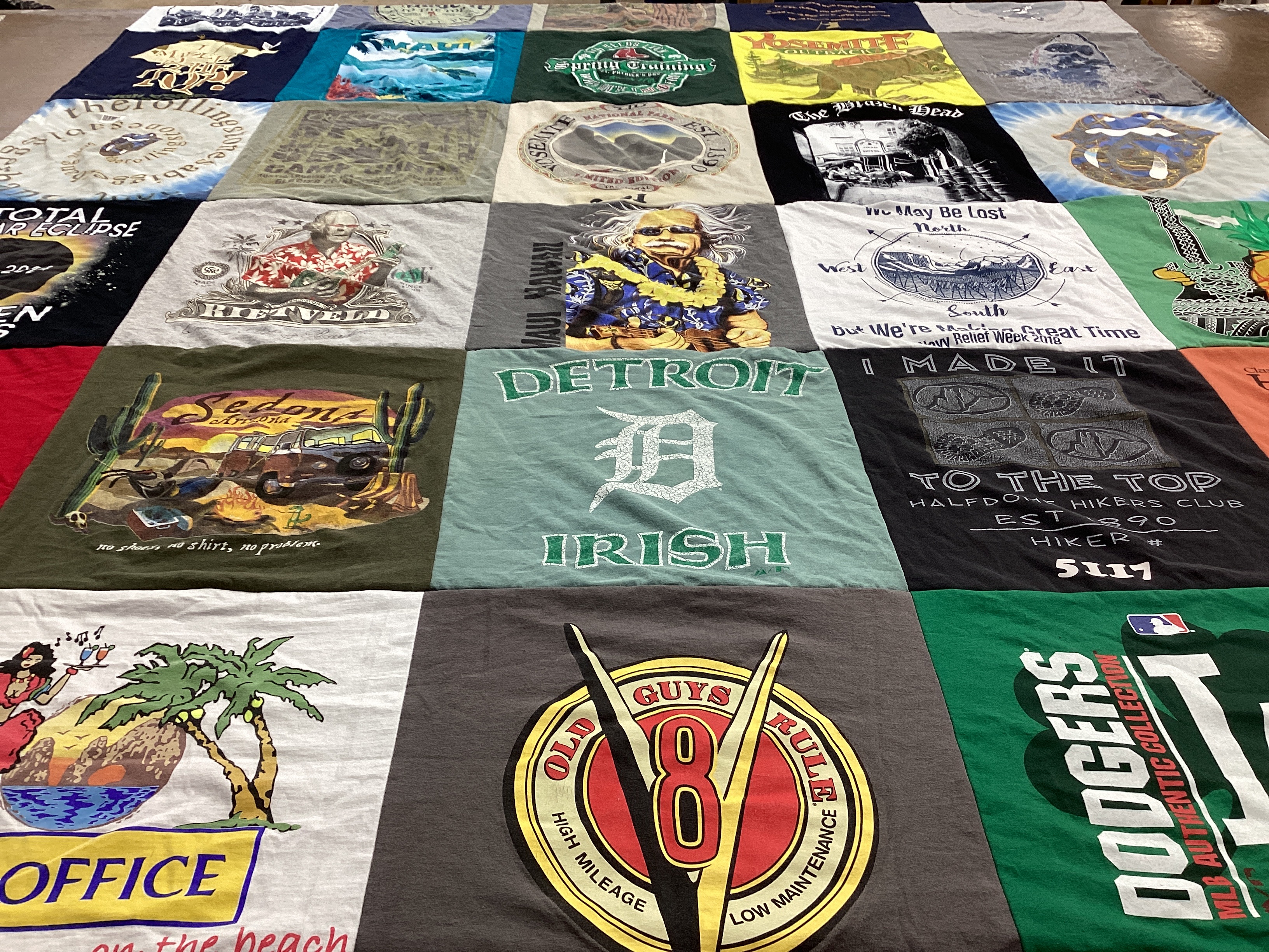 T-shirt quilt with hiking, travel themes by Claire from FL