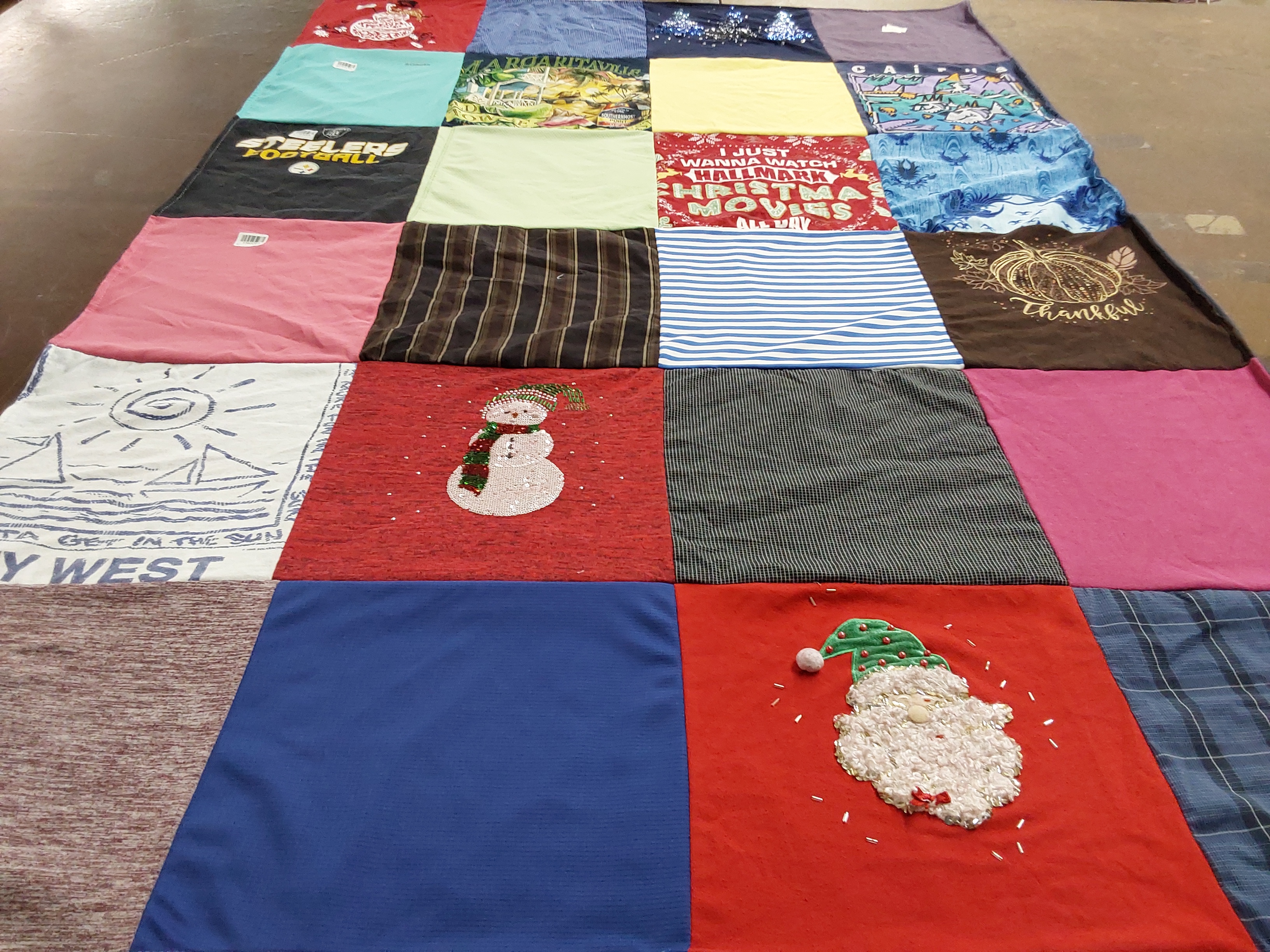 T-shirt quilt with holiday, travel themes by Rena from PA