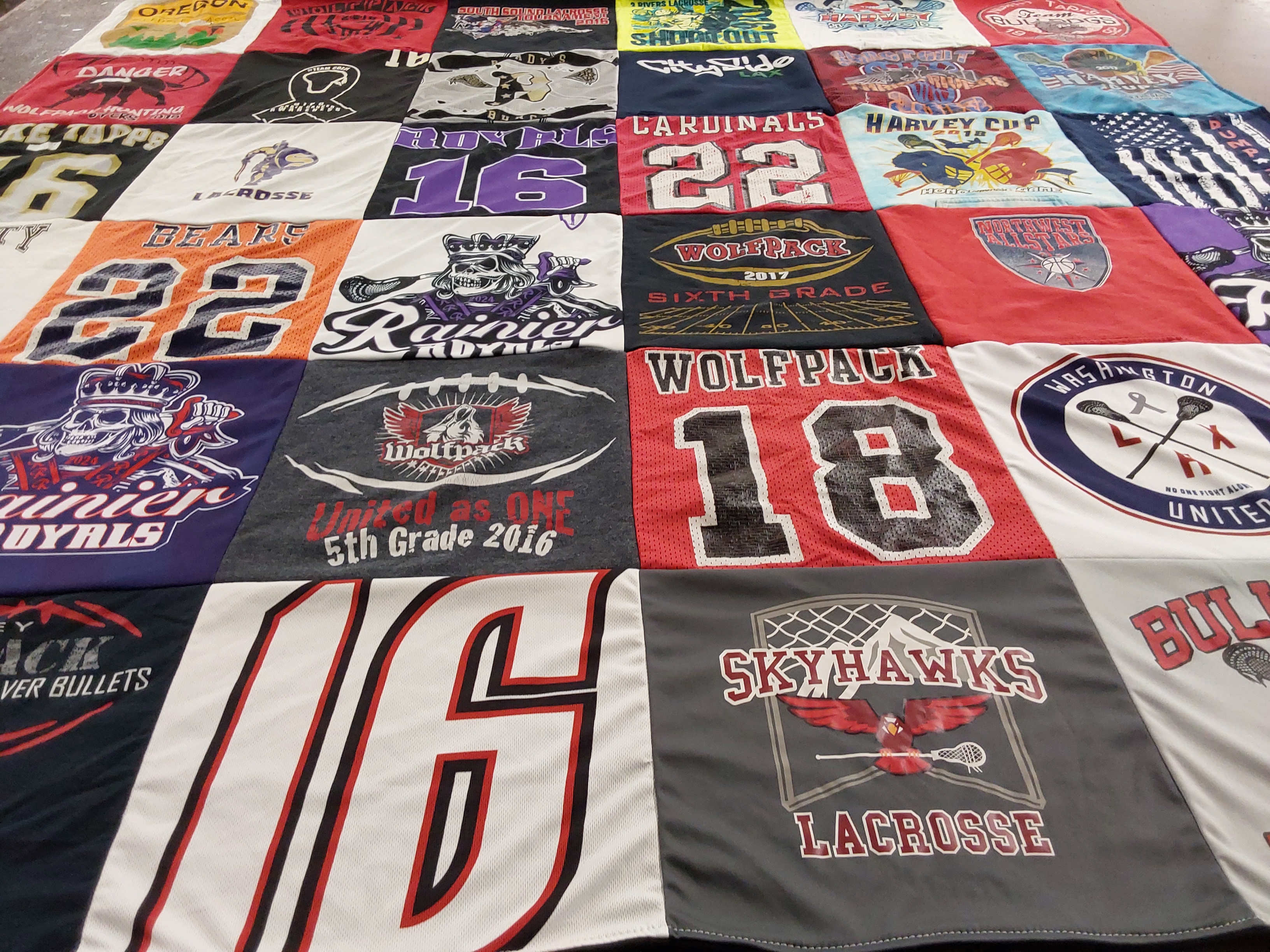 T-shirt quilt featuring wolfpack lacrosse team, skyhawks lacrosse team by Christie from ID