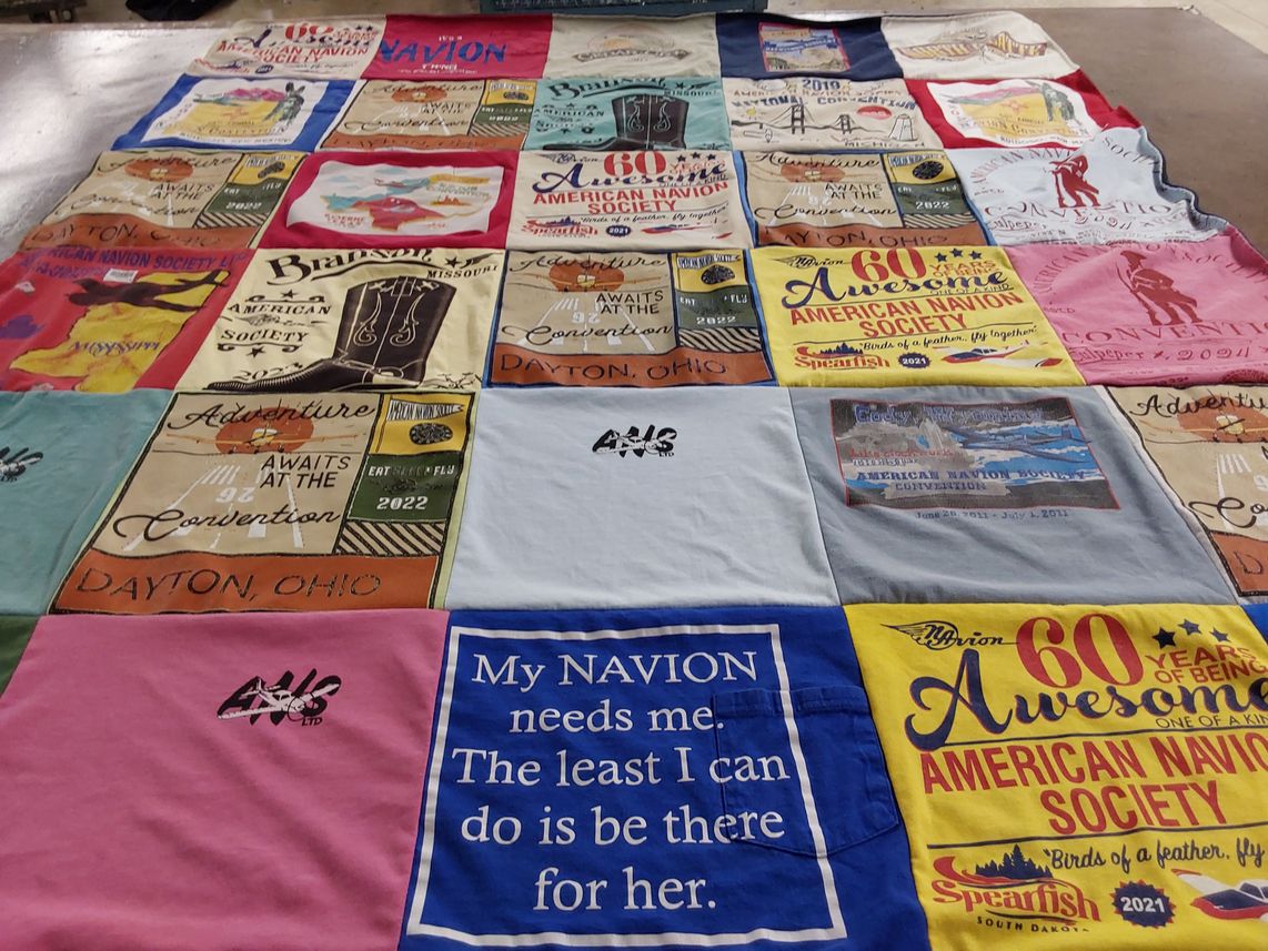 T-shirt quilt with aviation, community events themes by Wanda from GA