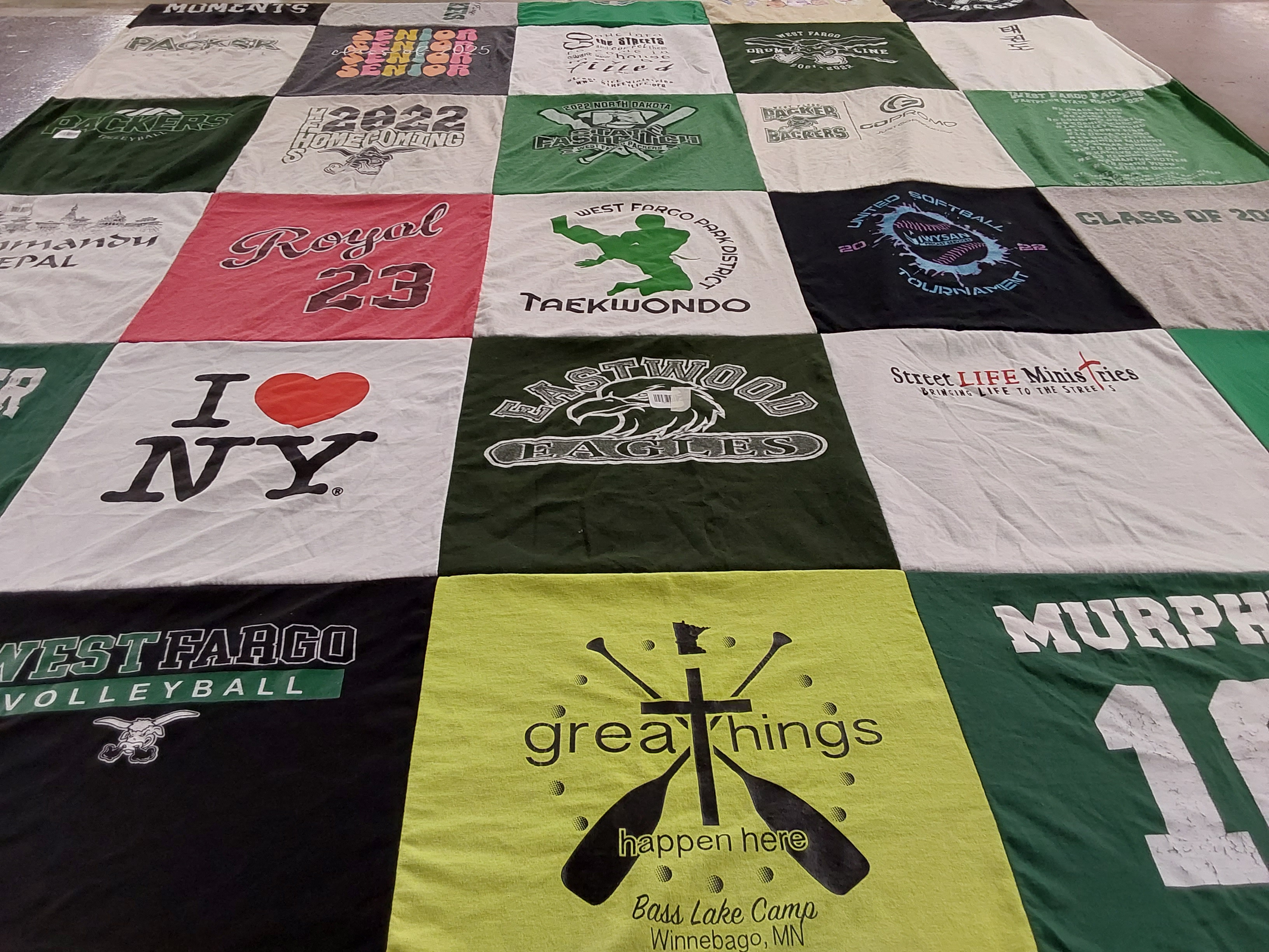 T-shirt quilt with sports, camping themes by AmyJo from ND