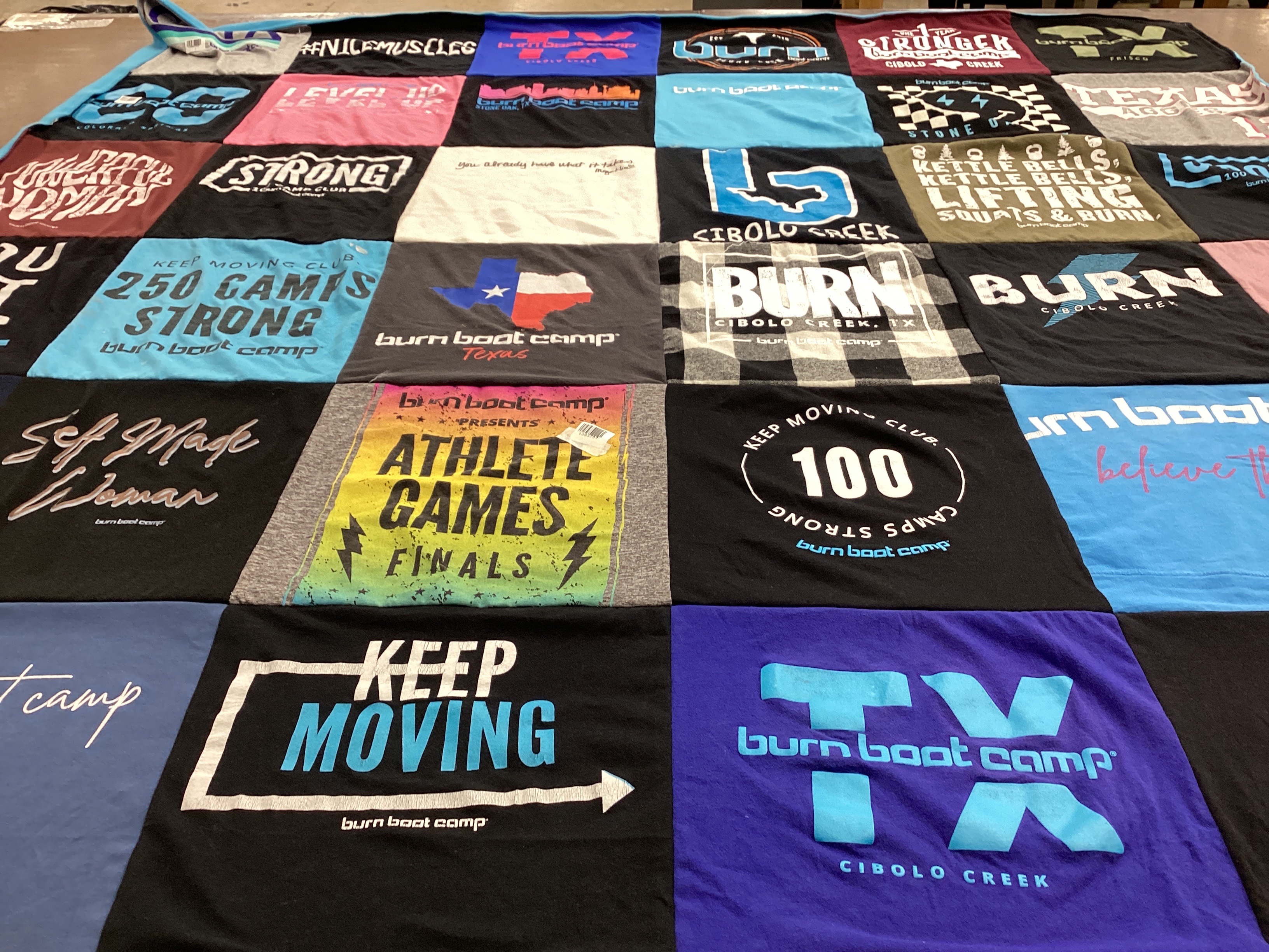T-shirt quilt with fitness, wellness themes by Holli from TX