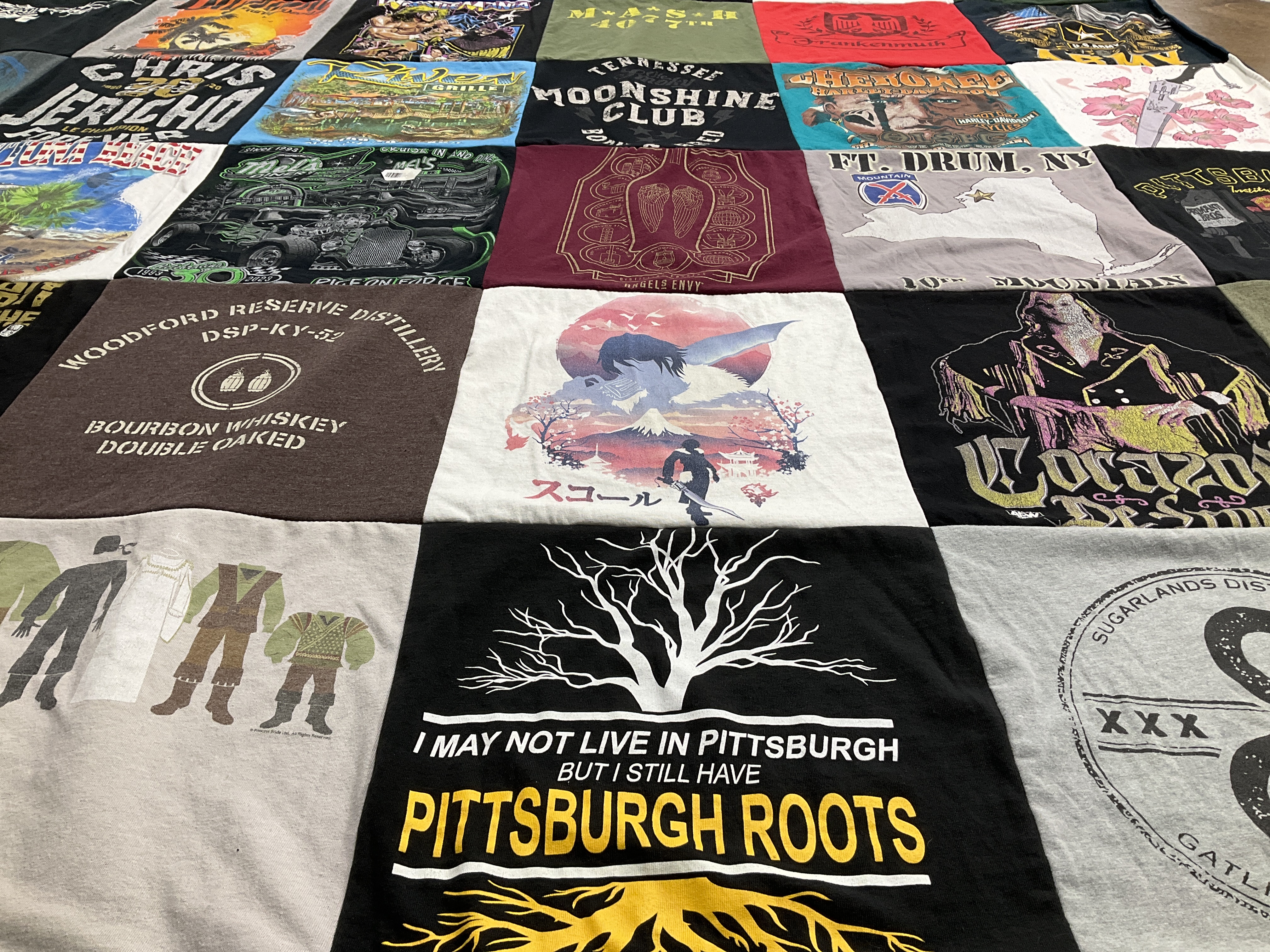 T-shirt quilt with distilleries, whiskey themes by Amy from OH