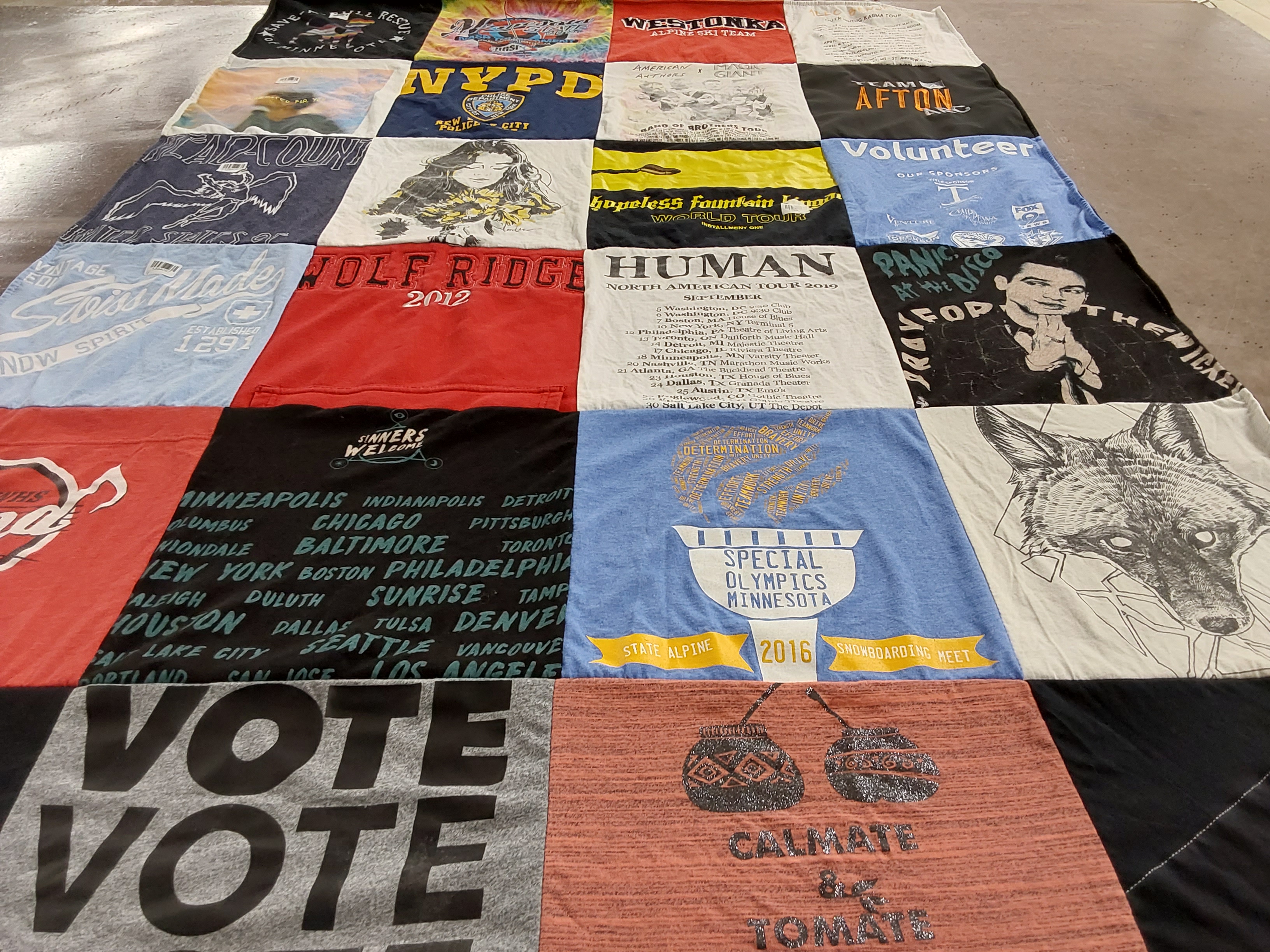 T-shirt quilt with community, volunteering themes by Morgan from MN