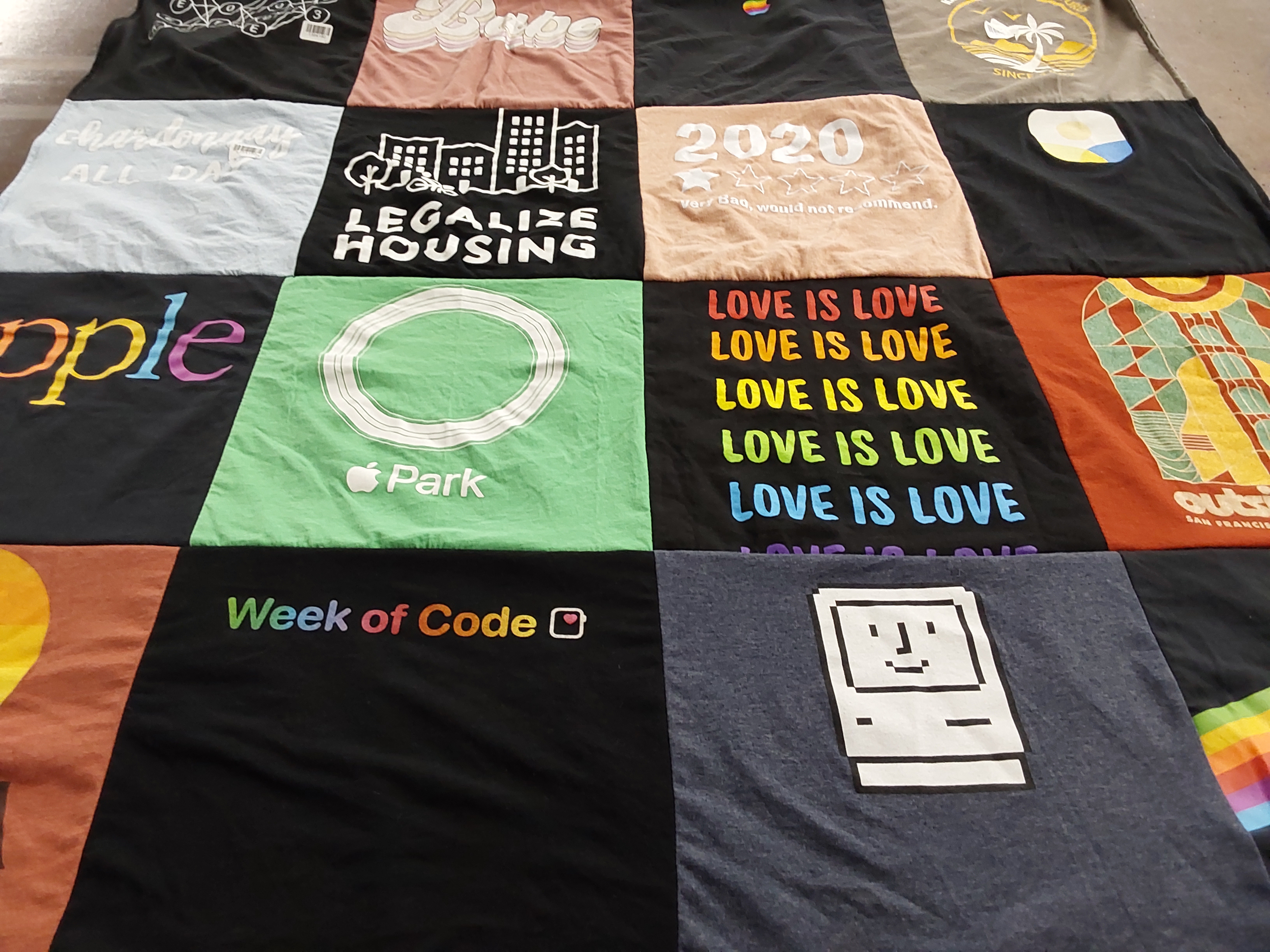 T-shirt quilt with technology, housing advocacy themes by Anne from CA