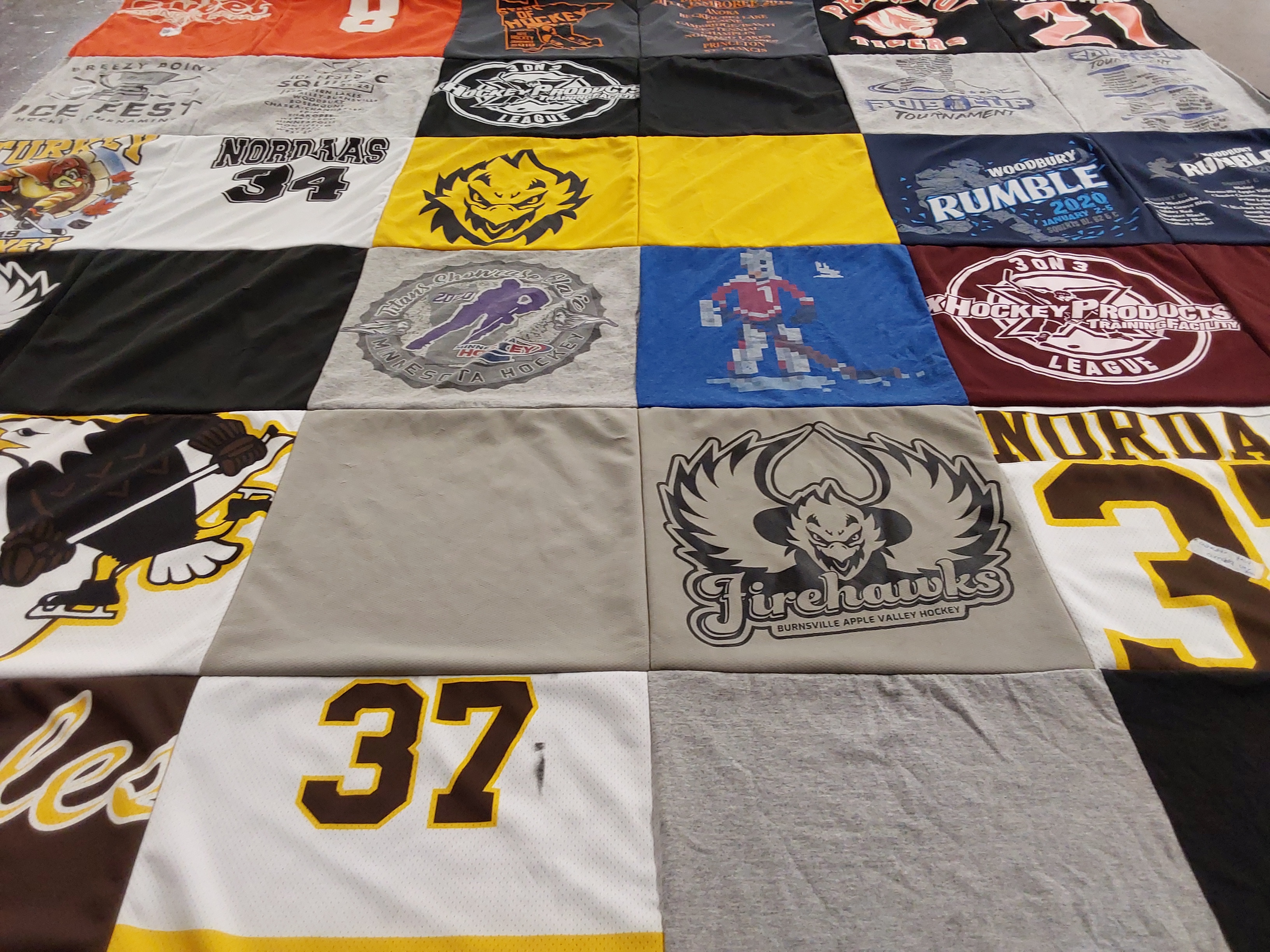 T-shirt quilt with hockey, sports themes by Aubrey from MN