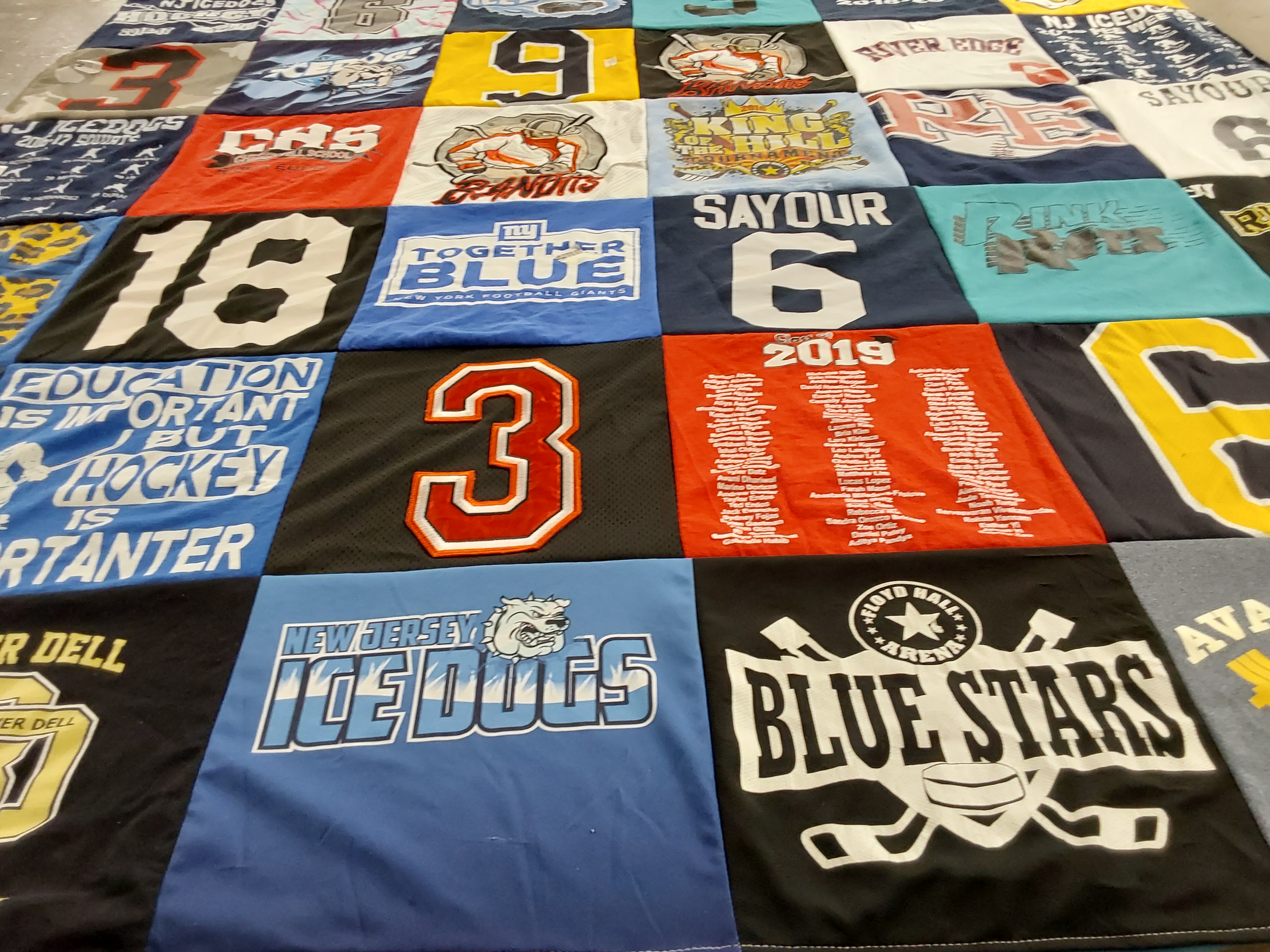 T-shirt quilt featuring new jersey ice dogs, blue stars by Claudine from NJ