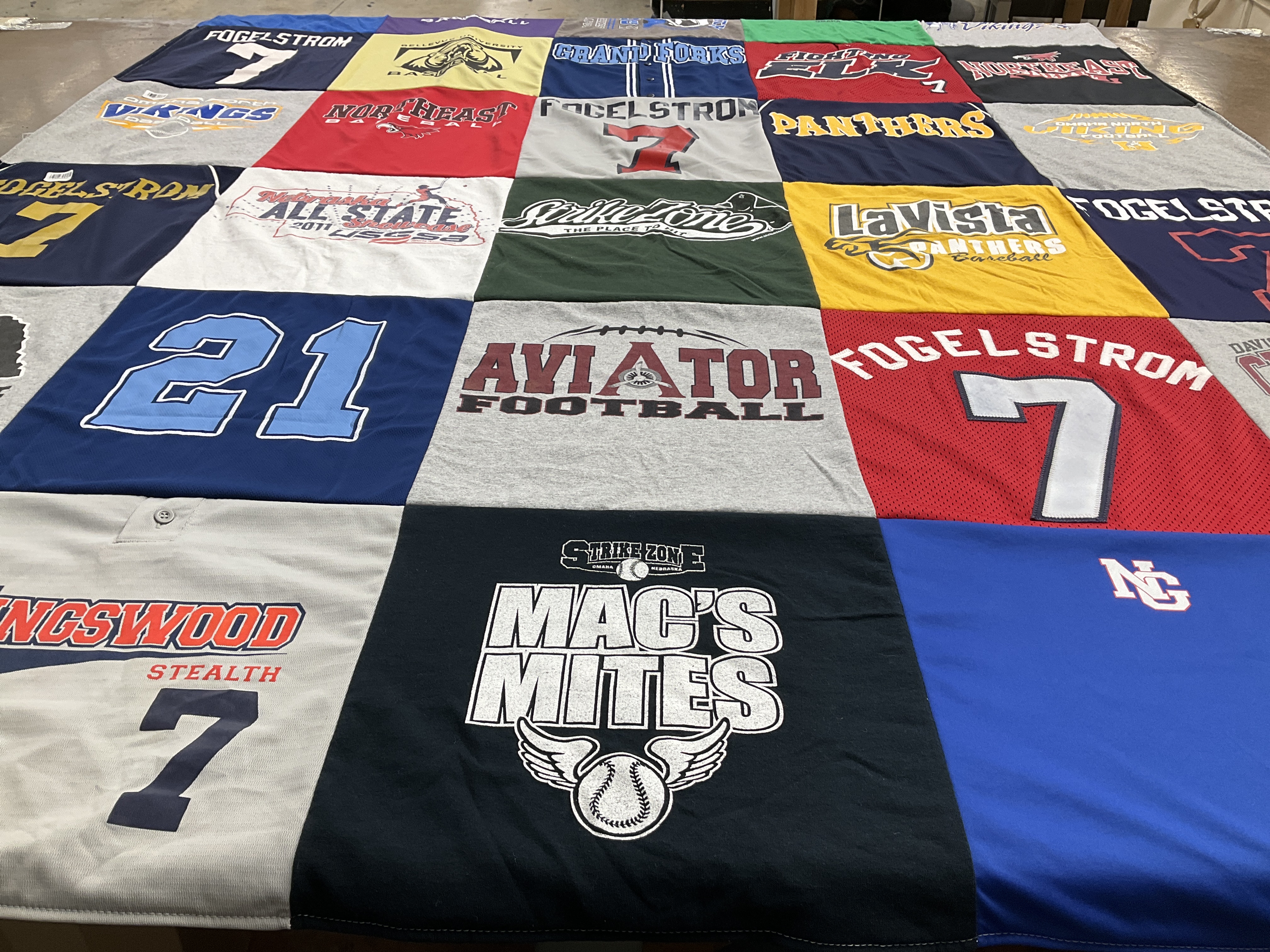 T-shirt quilt with sports, football themes by September from NE